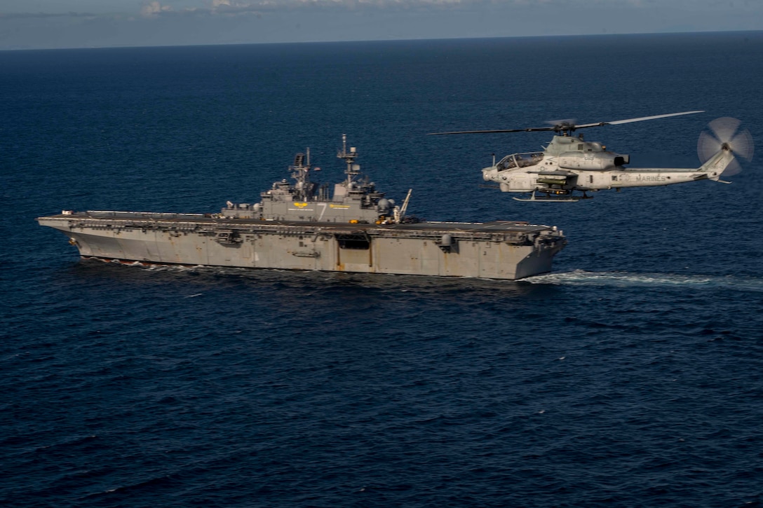 A U.S. Marine Corps AH-1Z Viper with Marine Light Attack Helicopter Squadron 369, Marine Aircraft Group 39, 3rd Marine Aircraft Wing, approaches amphibious assault ship USS Tripoli for landing during exercise Steel Knight 23, over the Pacific Ocean, Dec. 5, 2022. Exercise Steel Knight provides 3rd MAW an opportunity to refine Wing-level warfighting in support of I Marine Expeditionary Force and fleet maneuver.