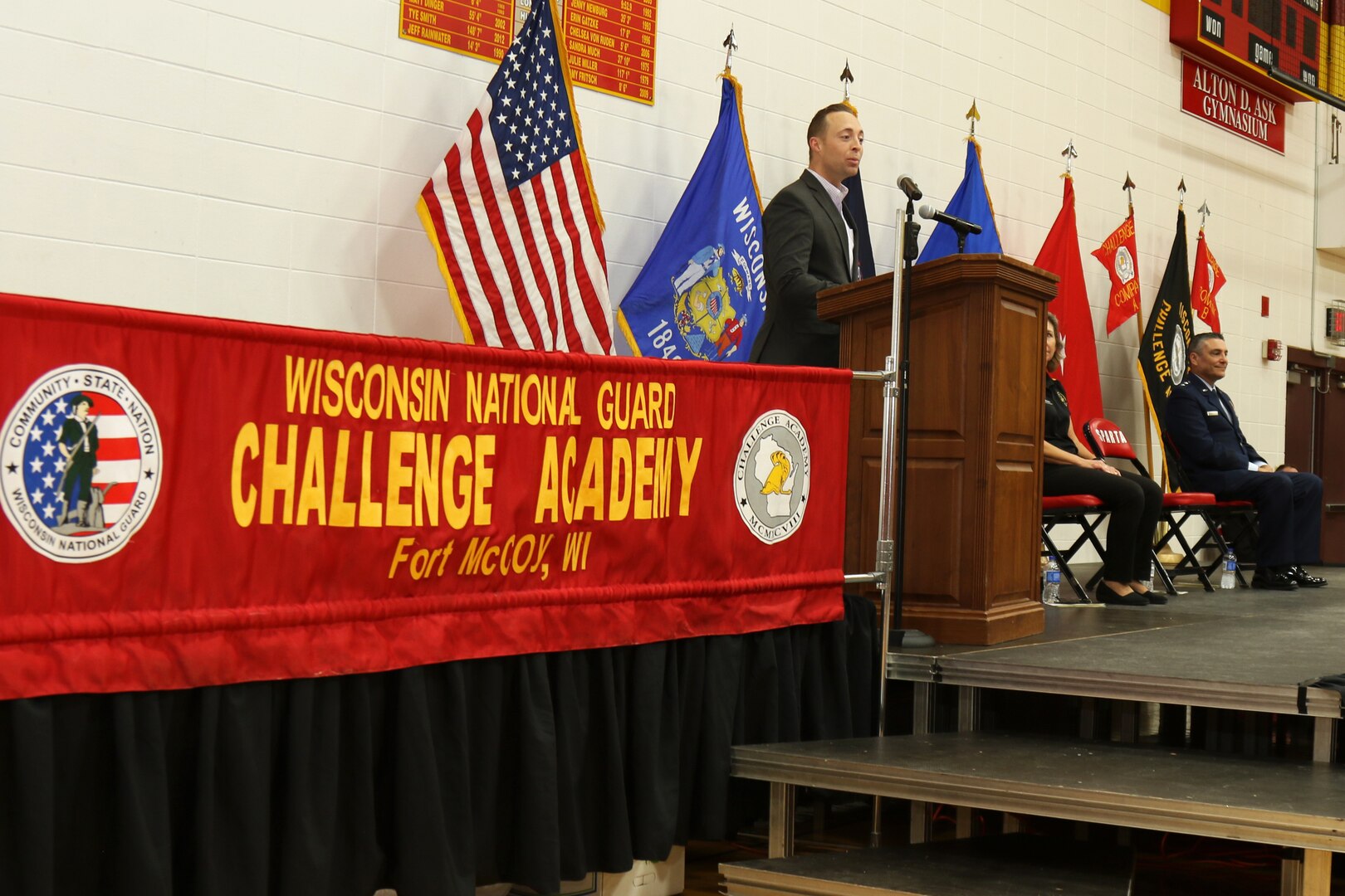 Chief Warrant Officer 3 Aaron Hunnel, keynote speaker, addresses seventy Wisconsin National Guard Challenge Academy graduates Saturday, Dec. 17 at Sparta High School, Sparta, Wis. Hunnel encouraged them to continue along the positive path the program has set them on. After graduating from the 22-week residential phase of academy training, cadets work with hometown mentors who offer guidance and encouragement in pursuing their new direction in life. The National Guard Youth Challenge Program currently operates 40 programs in 29 states, Puerto Rico and the District of Columbia. Nationwide, more than 190,000 teens have graduated from this free program since its inception in 1993. Wisconsin National Guard photo by Staff Sgt. Alice Ripberger