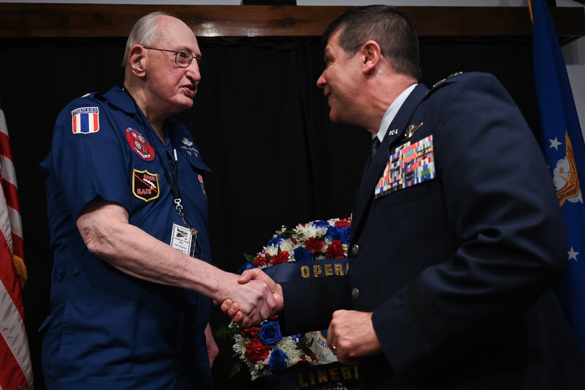 Maj Gen Gebara shakes Lt Col Blaufuss's hand