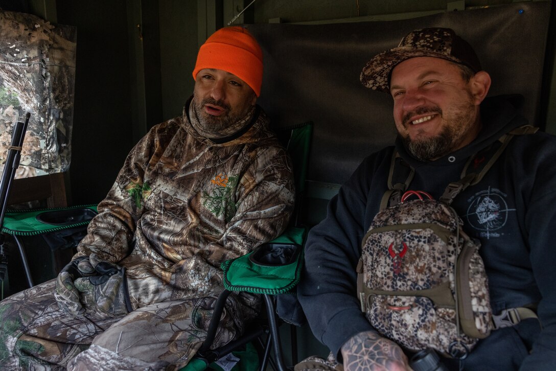 U.S. Marine Corps Master Sgt. Paul Starner,right, retired, serving as a volunteer hunting guide for Quantico Injured Military Sportsmen Association, discusses previous hunting experiences with Master Sgt. Ildefonso Aranda III,left, retired, on Marine Corps Base Quantico, Virginia, Dec. 10, 2022. QIMSA provides all-encompassing, expense-free outdoor experiences to combat wounded warriors, injured and ill from all branches of service, regardless of their hunting and fishing experience. Starner and Aranda both served21 years of honorable service. (U.S. Marine Corps photo by Lance Cpl. Jeffery Stevens)