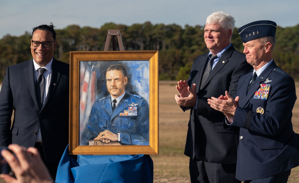 Doug Melville, great nephew of Gen. Benjamin O. Davis Jr. (from left,) Michael Fonseca, president of First Flight Society, Inc., Gen. Mark Kelly, commander of Air Combat Command