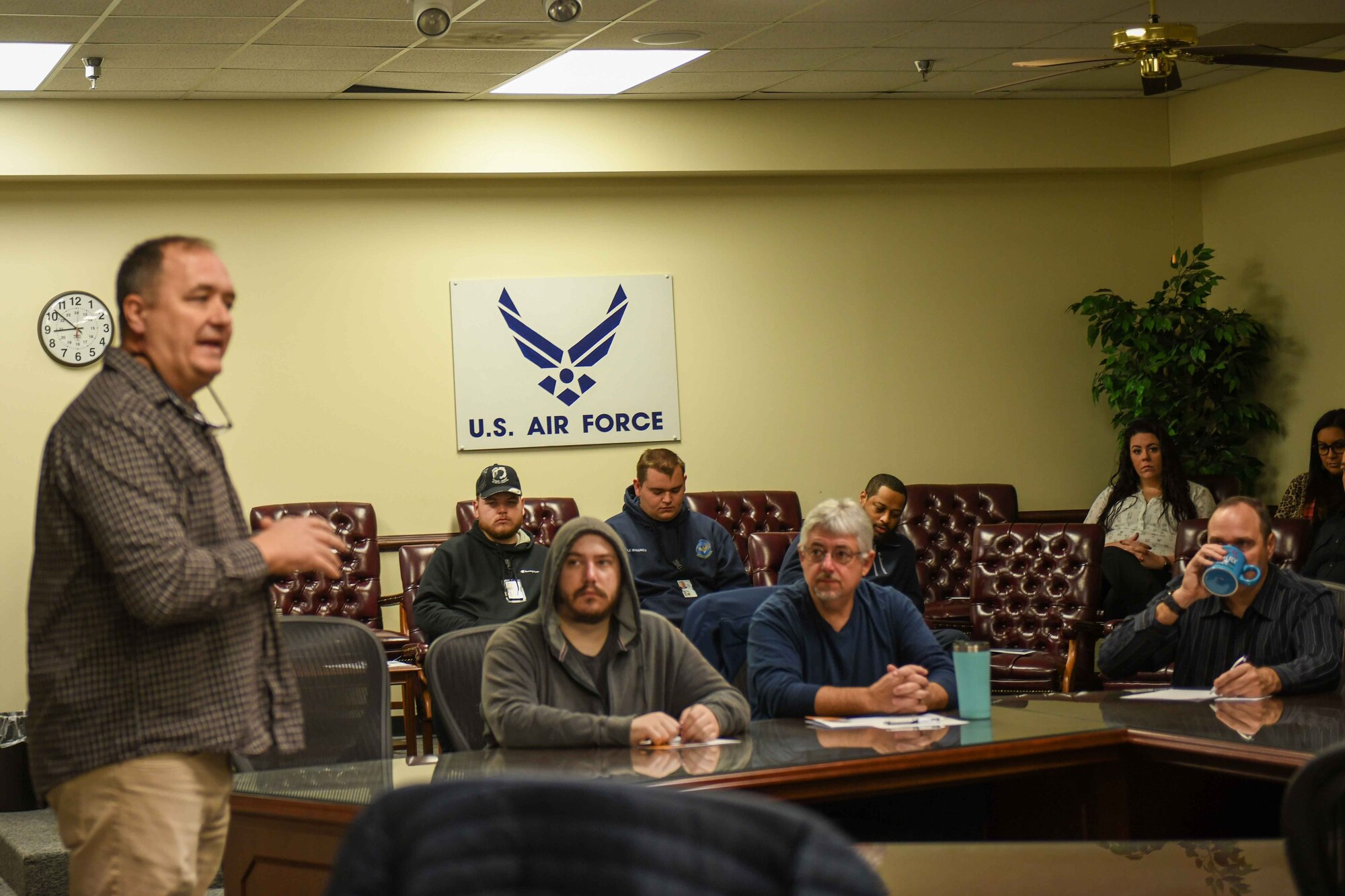 Tony Bunch, 97th Operations Support Squadron airfield manager, speaks to a group of more than 30 civilians at Altus Air Force Base, Oklahoma on Dec. 19, 2022. Bunch’s brief was about the benefits of being a Department of Defense employee including federal holidays, retirement plans, and access to mental health resources. (U.S. Air Force photo by Airman 1st Class Kari Degraffenreed)