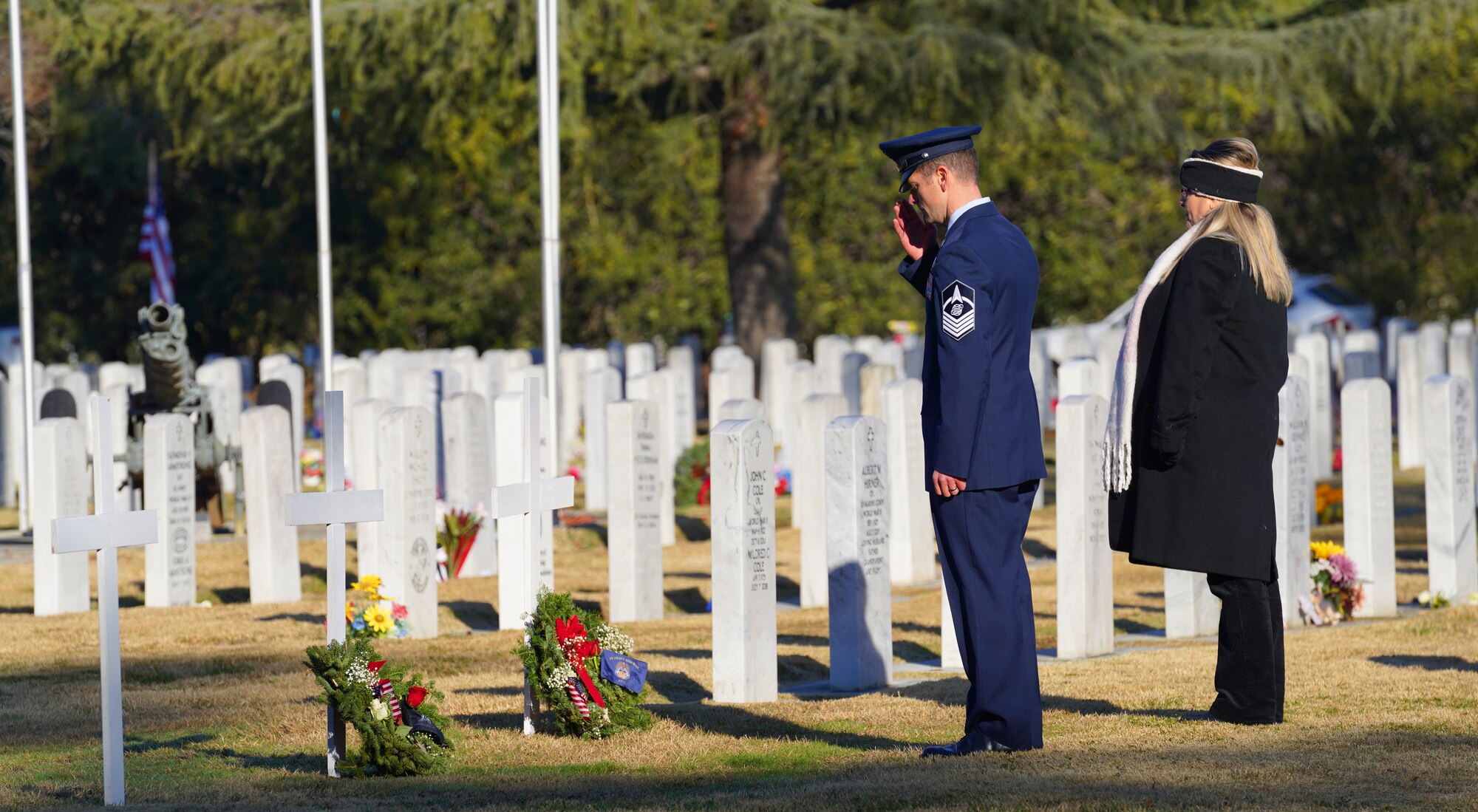U.S. Space Force Master Sgt. Jonathan Wander, 7th Space Warning Squadron senior enlisted leader, and Tammy Pack, retired Navy, lay down wreaths for the Space Force and Merchant Marines, Dec. 17, 2022, at the Sutter Cemetery, Sutter, Calif.