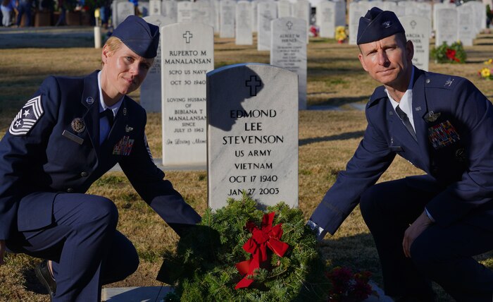 Col. Geoffrey Church, 9th Reconnaissance Wing commander, and Chief Master Sgt. Breana N. Oliver, 9th RW command chief, lay down a wreath  during the Wreaths Across America ceremony Dec. 17, 2022, at Sutter Cemetery, Sutter, Calif.