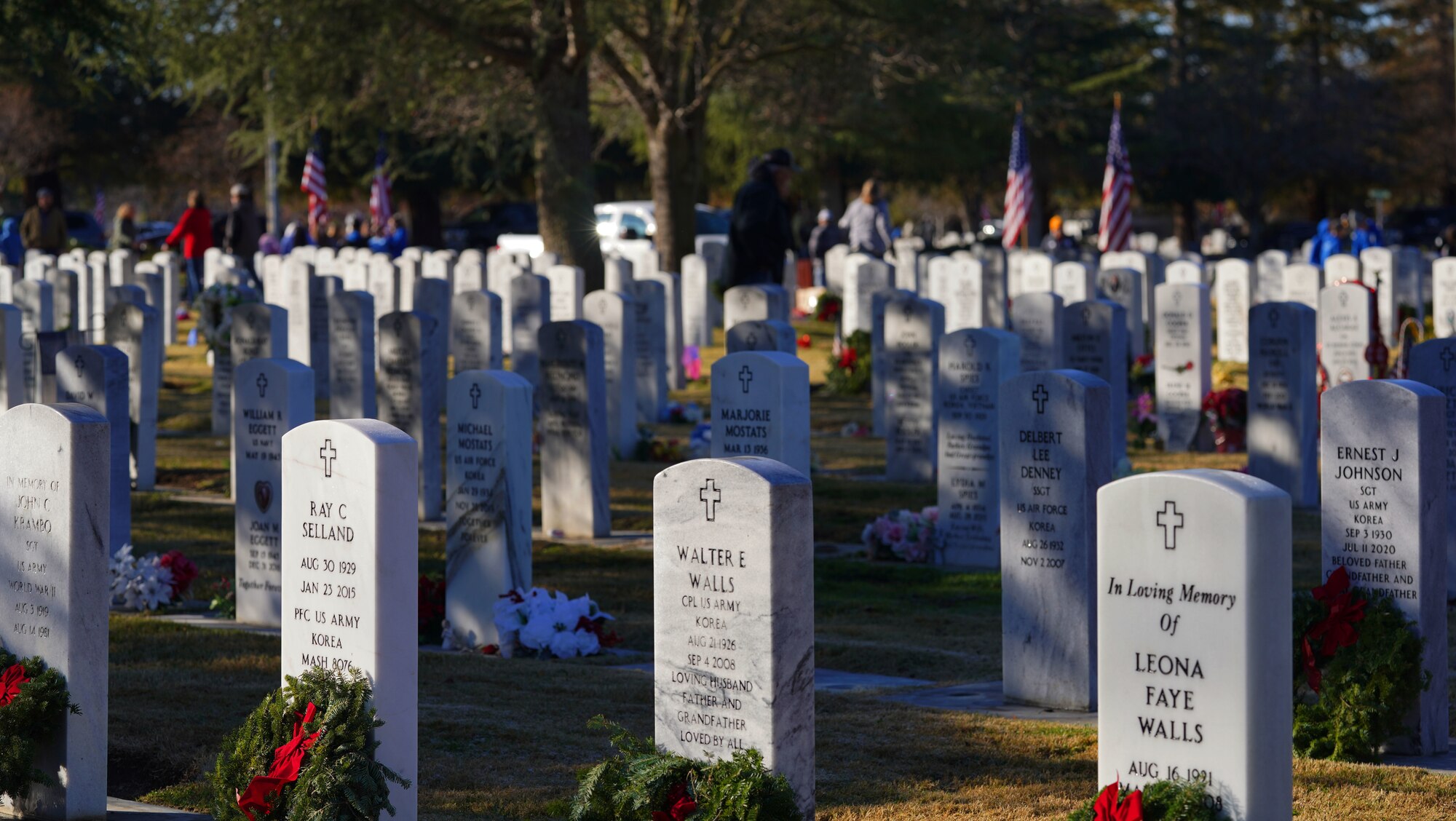 Wreaths lay on tombstones Dec. 17, 2022, at the Sutter Cemetery, in Sutter, Calif.