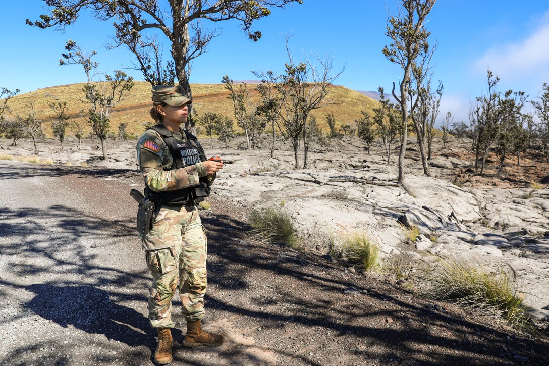 558th Military Police Company, 728th Military Police Battalion, 8th Military Police Brigade Soldier, Staff Sgt. Jaelene Leavitt measures air quality during a law enforcement operation on Pohakuloa Training Area, Hawaii, Dec. 10, 2022. The “Warfighters” Battalion Soldiers were tasked to assist Department of the Army (DA) Civilian Police officers on PTA, in response to increased road traffic due to a nearby volcanic eruption.