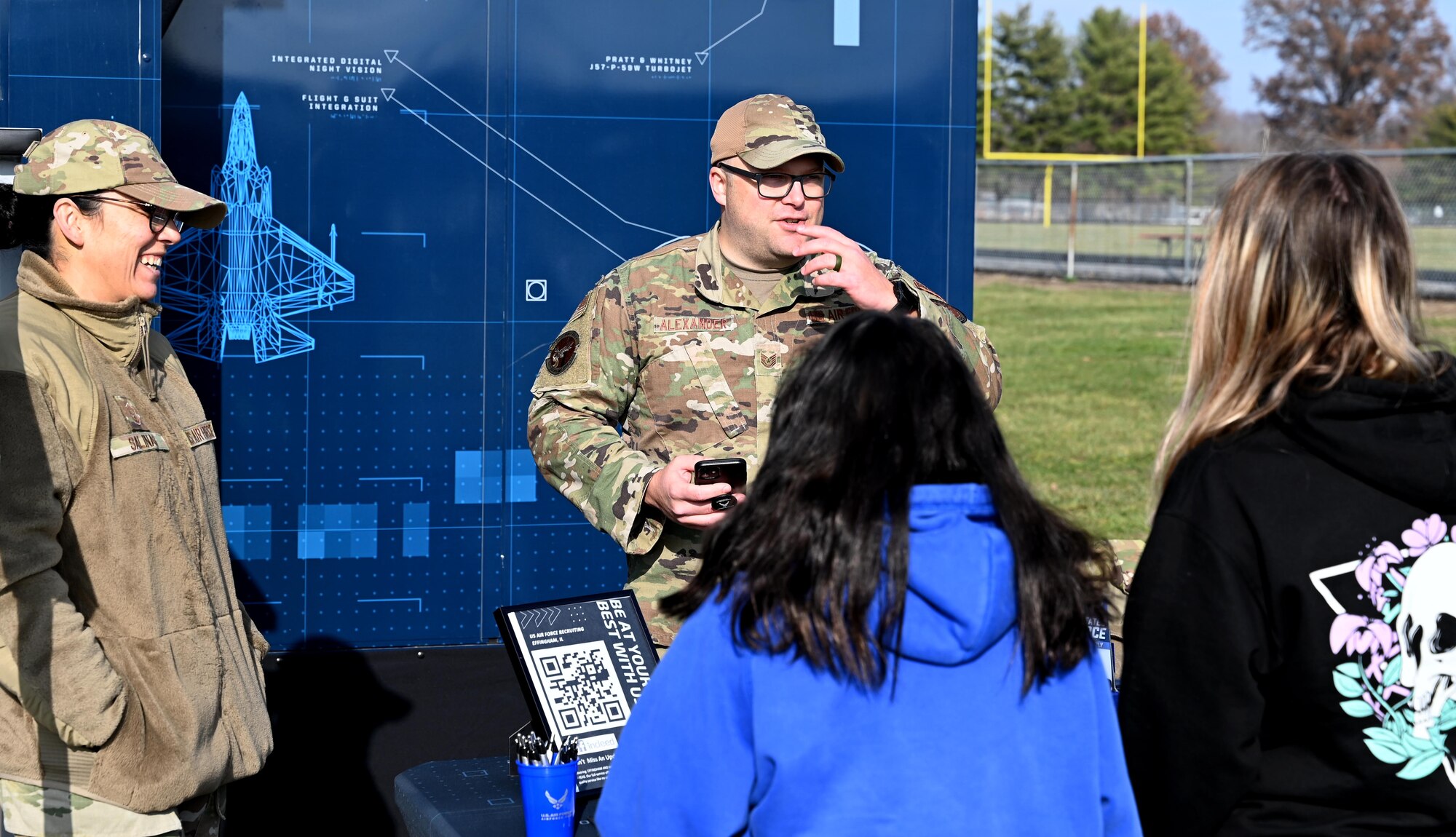 High school students operate an Air Force F-35 computer flight simulation