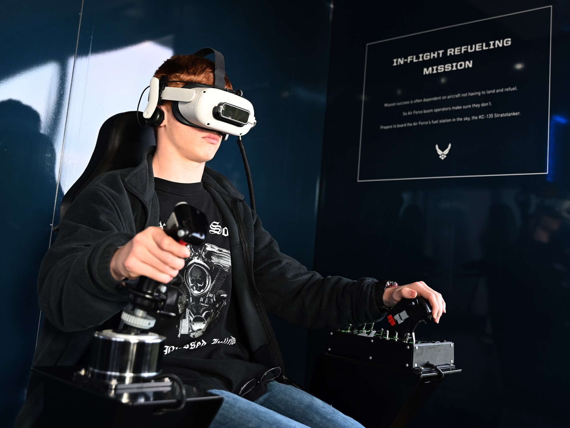 High school students operate an Air Force F-35 computer flight simulation