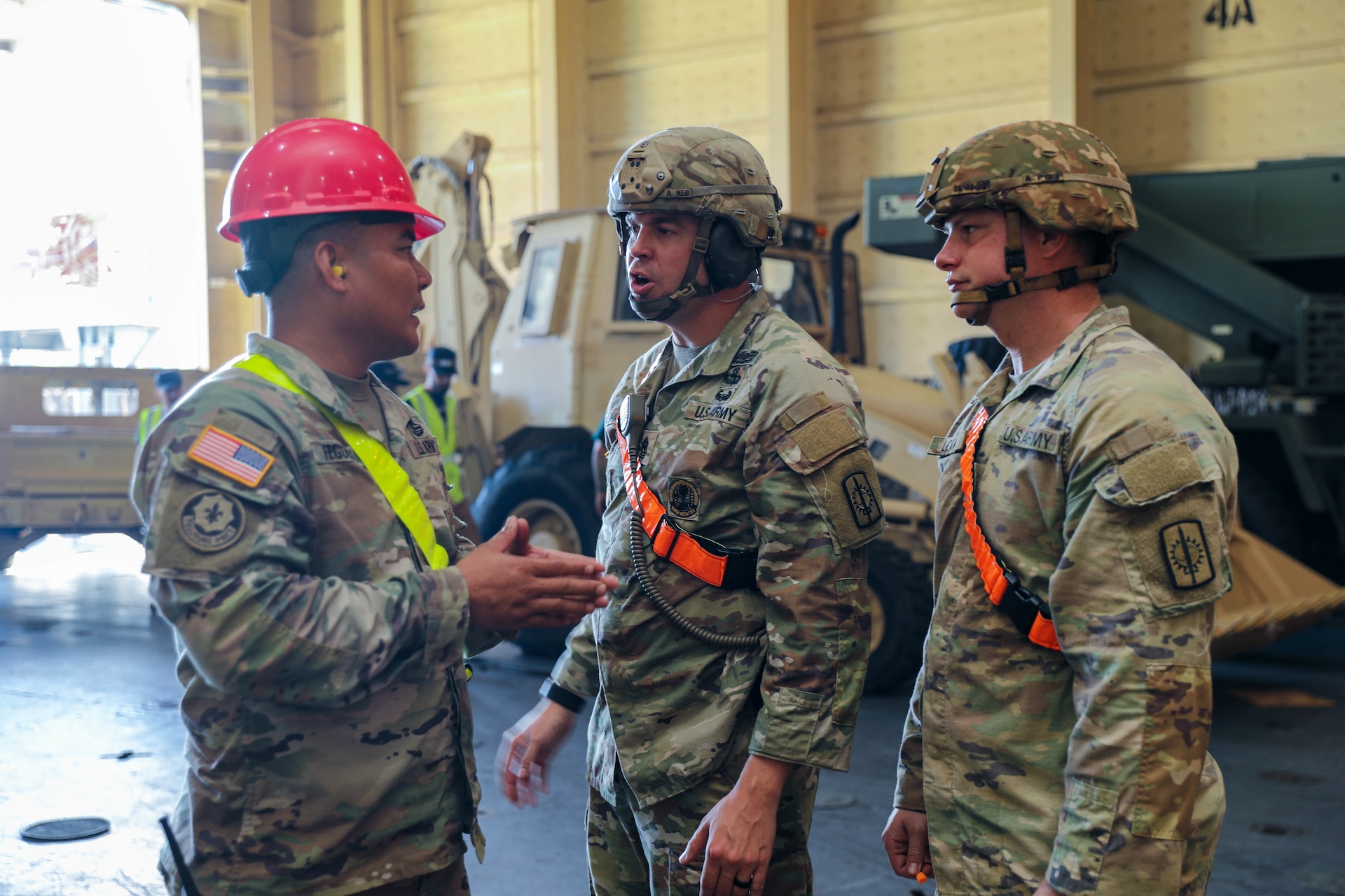 Headquarters, Headquarters Company, 8th Military Police Brigade Soldiers, Cpt. Jason Fegurgur, 1st Sgt. Aaron Duhachek, and Staff Sgt. Lucas Lock handled the accountability of personnel and equipment throughout all phases of the movement operation, as part of Army Prepositioned Stock-3, on Joint Base Pearl Harbor-Hickam, Hawaii, Nov. 29 - Dec. 1, 2022. The "Watchdogs" Brigade executed oversight as the Command and Control (C2) authority over the movement of each piece of equipment downloaded from the U.S. Naval Ship Watson.