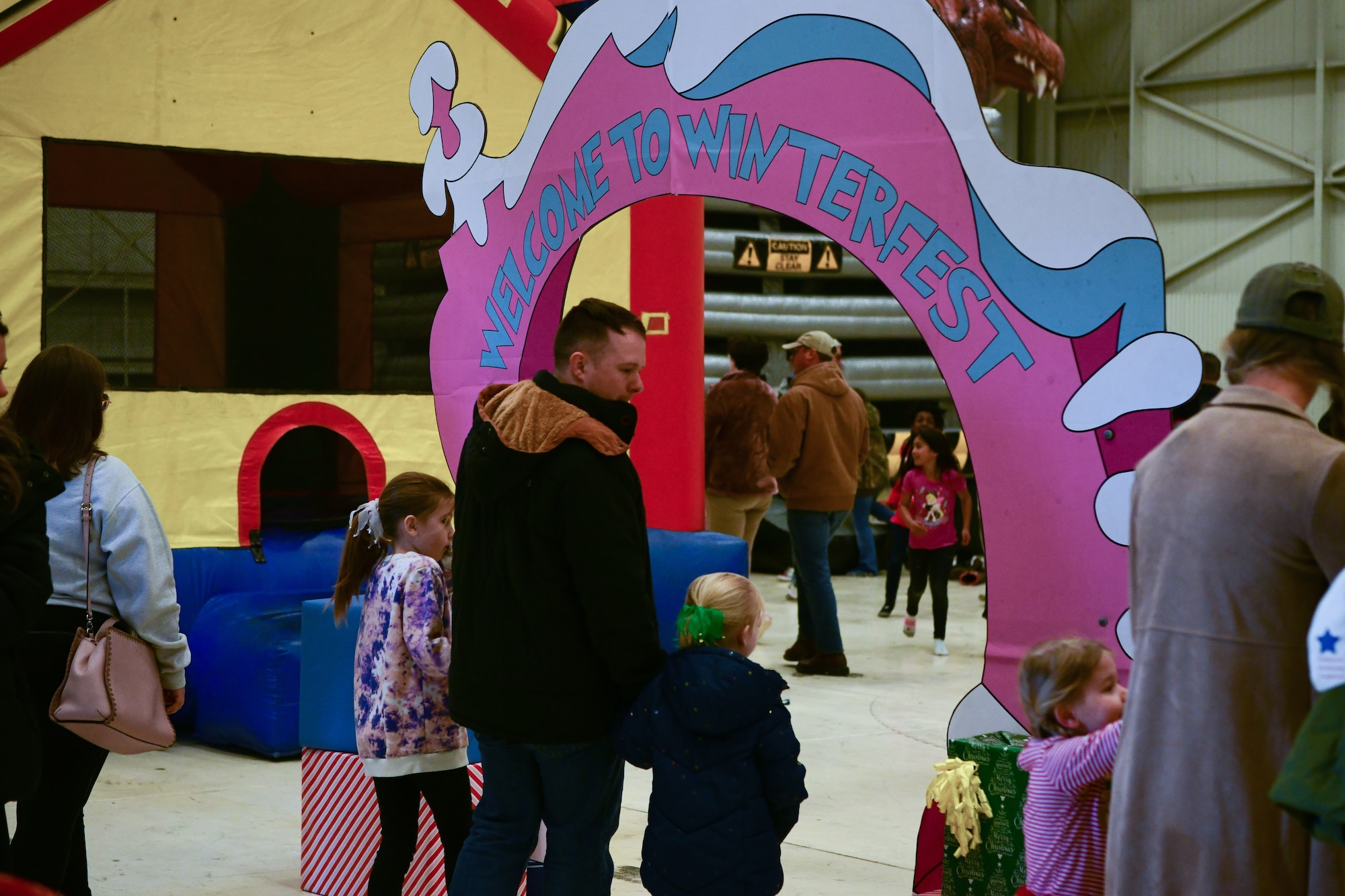 Families enter the Winterfest on the flightline at Beale Air Force Base, Calif. on Dec. 17, 2022.