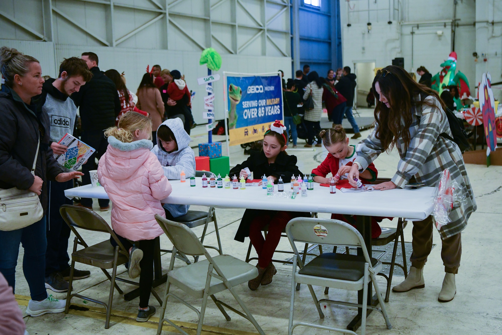 Children decorate stockings at the Winterfest on the flightline on Beale Air Force Base, Calif. on Dec. 17, 2022.
