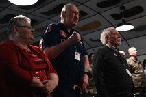 Veterans and attendees sing the Air Force song during the Operation Linebacker II Memorial ceremony