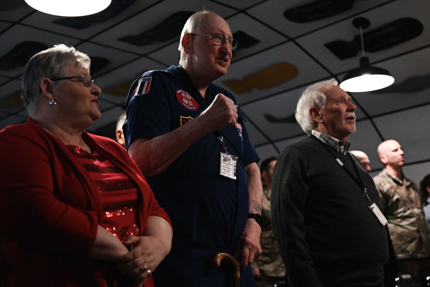 Veterans and attendees sing the Air Force song during the Operation Linebacker II Memorial ceremony