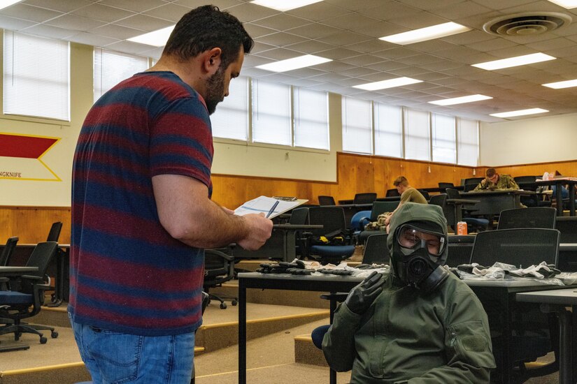 An anthropologist from the U.S. Army Combat Capabilities Development Command directs a U.S. Army Trooper assigned to 3d Cavalry Regiment while testing newly designed chemical, biological, radiation, and nuclear protection equipment Dec. 8, 2022, at Fort Hood, Texas.