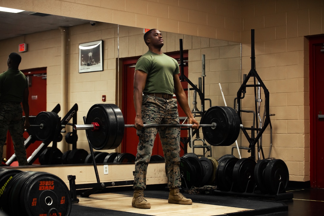 U.S. Marine Corps Cpl. Anthony D. Morris, a Marine Air-Ground Task Force planning specialist with Plans Policies and Operations South, executes a deadlift in the Camp Elmore Gymnasium, Norfolk, Virginia, Dec. 12, 2022. Morris participated in a High Intensity Tactical Training competition on Marine Corps Base Quantico against Marines from various units. He was awarded first place after he conducted a series of exercises scored based on timing and execution. (U.S. Marine Corps photo by Cpl. Angel Alvarado)