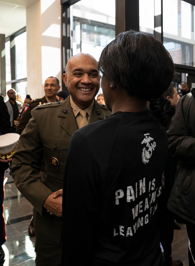 U.S. Marine Corps Lt. Gen. Brian W. Cavanaugh, the Fleet Marine Force, Atlantic, Marine Forces Command, Marine Forces Northern Command commander, greets U.S. Marine Corps Pfc. Jayln Morton, an inventory management specialist at Joint Base Anacostia-Bolling during the course completion ceremony for the Freestate Challenge Academy at Havre De Grace High School, Maryland on Dec. 17, 2022. The Academy’s mission is to intervene in and reclaim the lives of at-risk youth and to produce graduates with the values, skills, education and self-discipline needed to succeed as adults. More than 4,000 cadets have graduated since the Academy’s beginning in 1993. (U.S. Marine Corps photo by Cpl. Hannah Adams)
