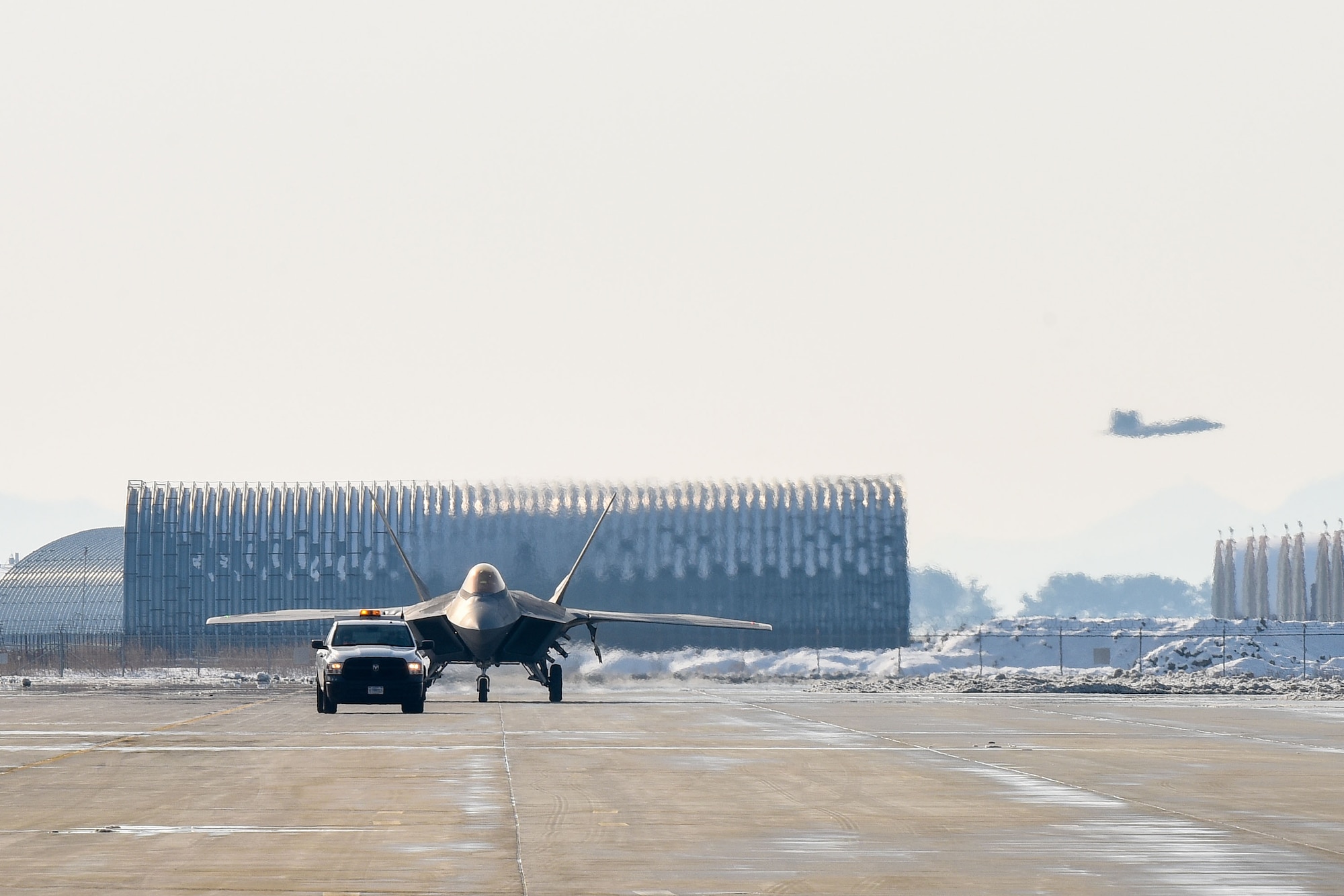 An F-22 Raptor assigned to 525th Fighter Squadron, Joint Base Elmendorf-Richardson, Alaska, taxis on the runway at Kunsan Air Base, Republic of Korea, Dec. 20, 2022, prior to returning to U.S. Marine Corps Station Iwakuni, Japan. The aircraft was taking part in the Iron Shadow joint training event, designed to enhance joint and bilateral interoperability between U.S. Air Force and ROK Air Force assets. Training among multiple-generation aircraft ensures combat readiness in a dynamic environment and helps reassure the Republic of Korea of the United States’ continued commitment to ensuring a free and open Indo-Pacific. (U.S. Air Force photo by Tech. Sgt. Timothy Dischinat)