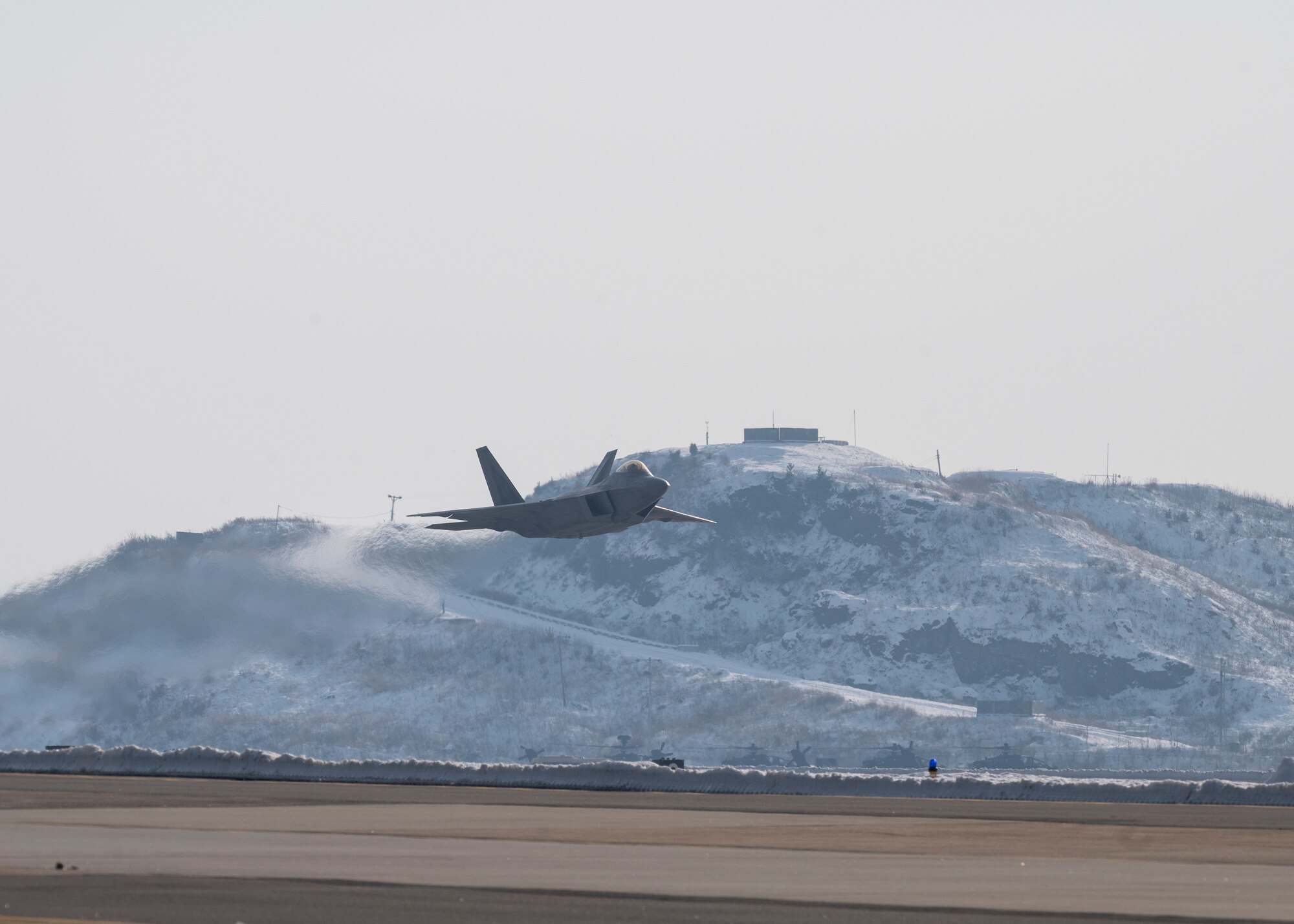 An F-22 Raptor assigned to the 525th Fighter Squadron, Joint Base Elmendorf-Richardson, Alaska, performs a low pass at Kunsan Air Base, Republic of Korea, Dec. 20, 2022.