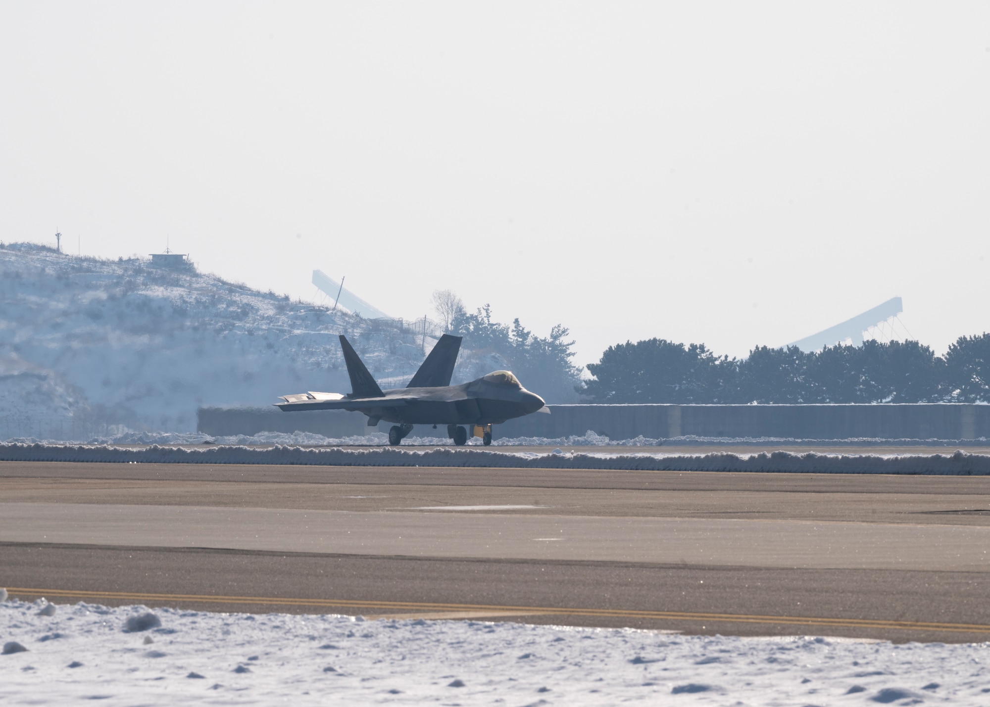 An F-22 assigned to the 525th Fighter Squadron, Joint Base Elmendorf-Richardson, Alaska, touches down at Kunsan Air Base, Republic of Korea, Dec. 20, 2022.