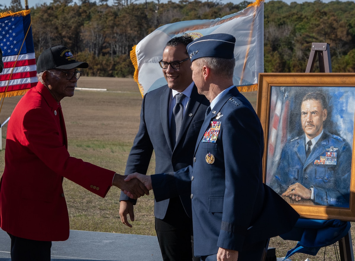 Tuskegee Airmen (from left,) Doug Melville, great nephew of Gen. Benjamin O. Davis Jr., and U.S. Air Force Gen. Mark Kelly, commander of Air Combat Command