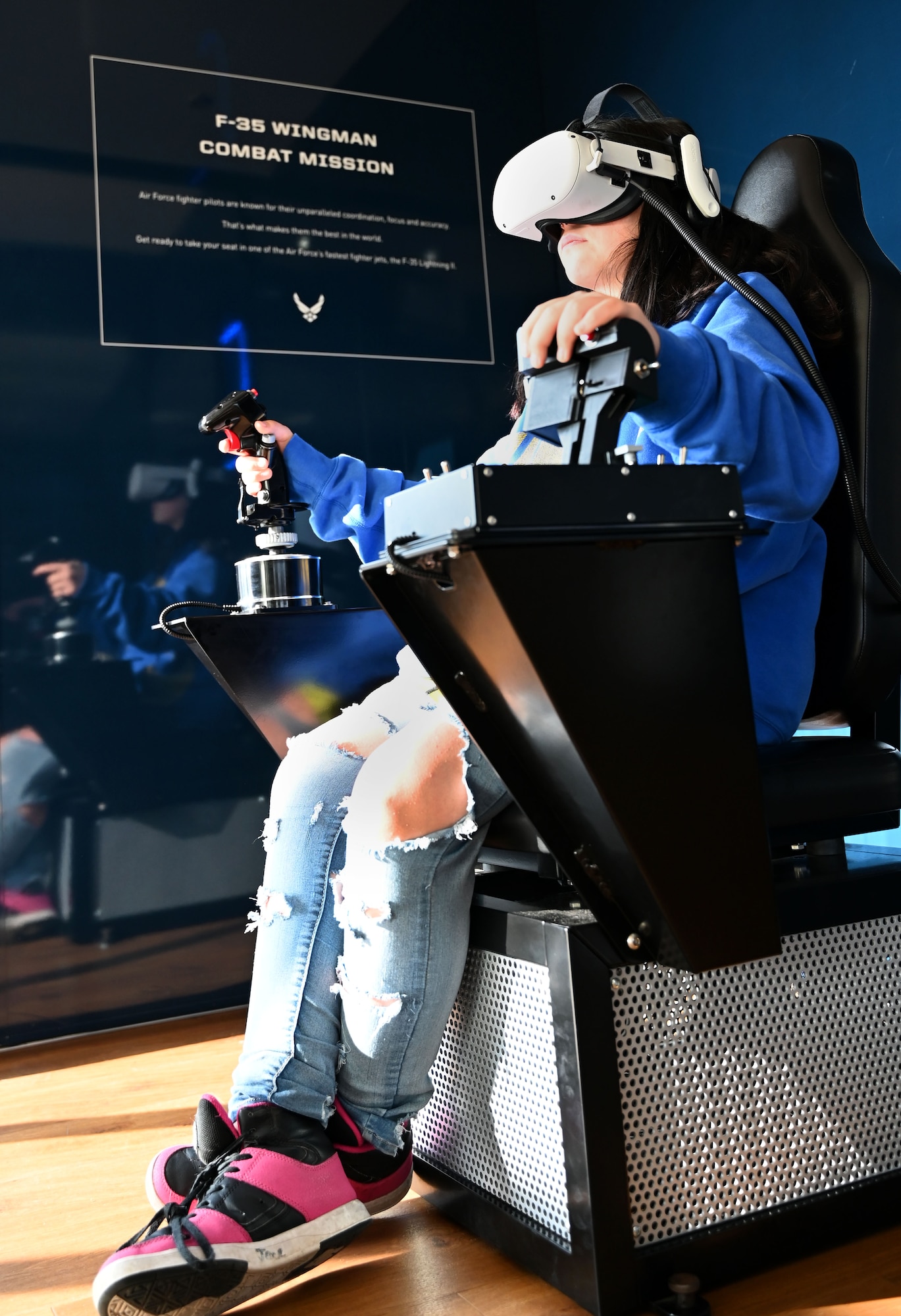 High school students operate an Air Force F-35 computer flight simulation
