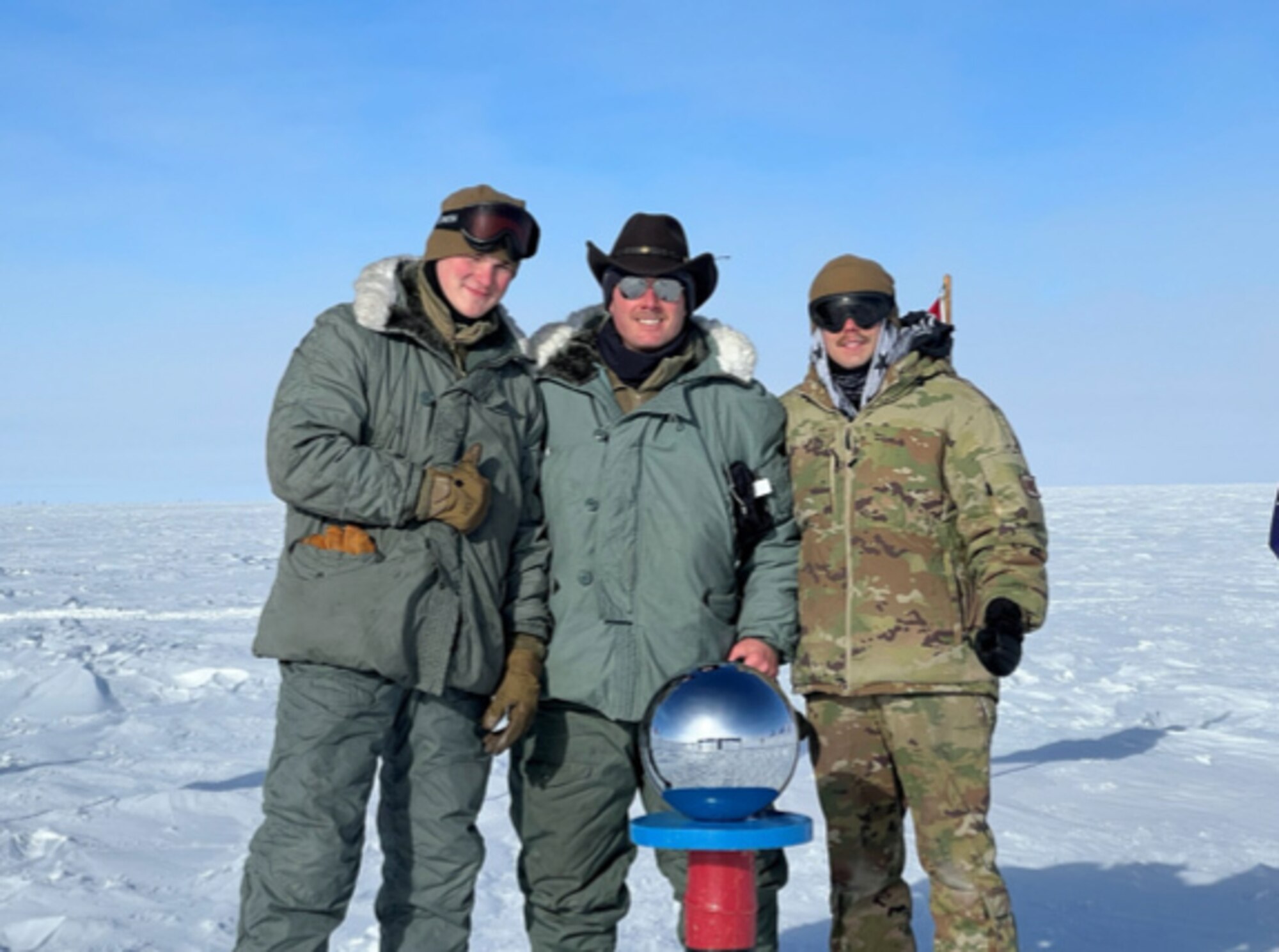 From left, Staff Sgt. Grant Santese, Tech Sgt. Daniel Craig and Staff Sgt. Jonathan Hooker worked tirelessly for two days in extreme weather at the South Pole to get an LC-130 Skibird airborne after a mechanical malfunction at the end of November 2022.