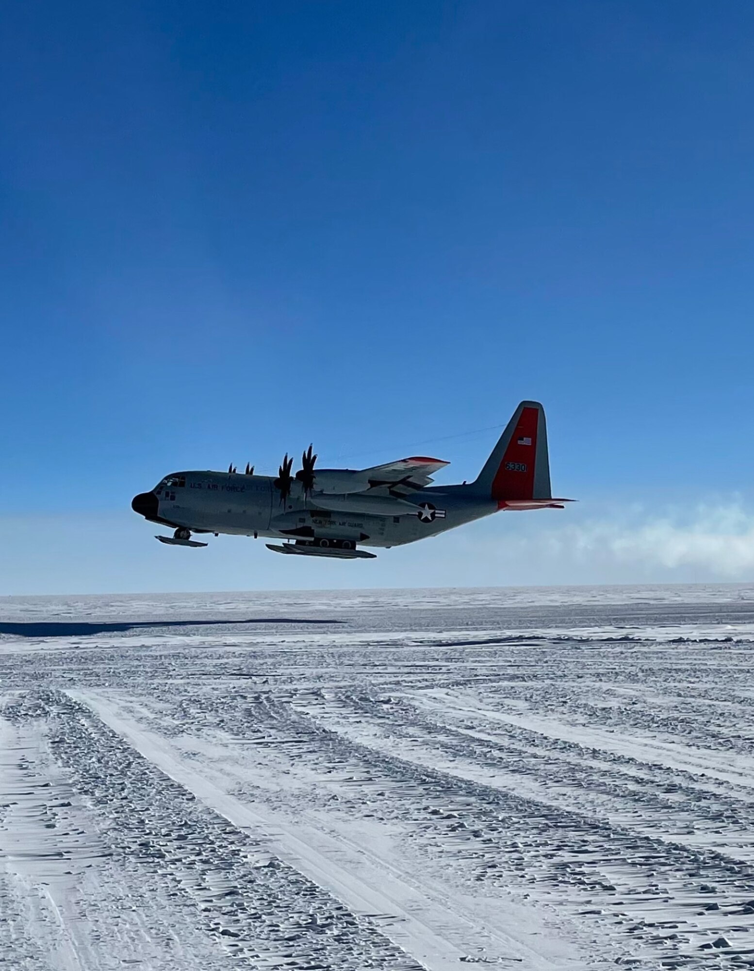 A LC-130 Skibird takes off from Amundson-Scott South Pole Station after being repaired on the open skiway. A maintenance team of National Guard Airmen from New York, Kentucky and Pennsylvania flew in to repair the aircraft.