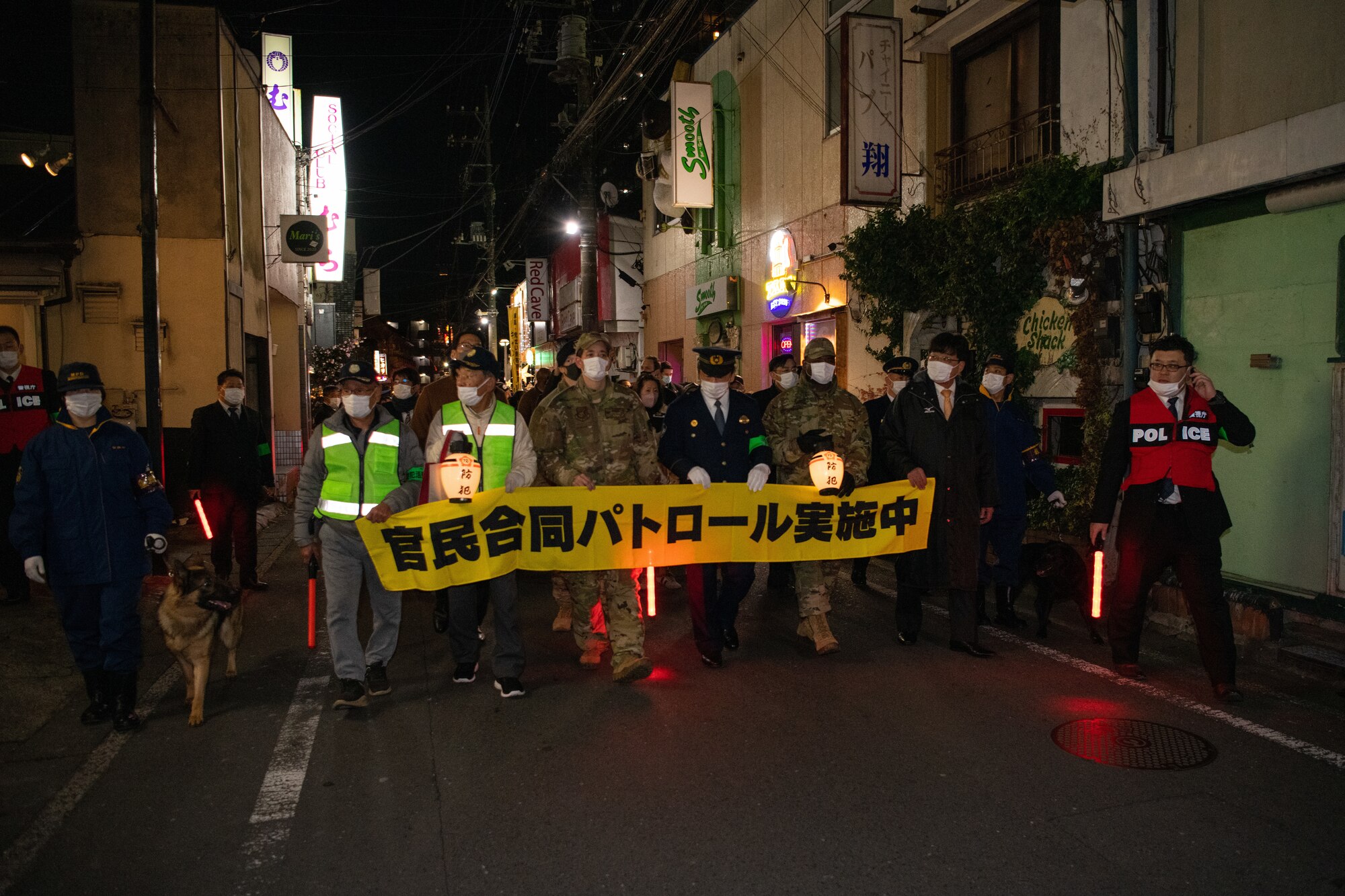 Community members walk along popular drinking areas during a joint safety patrol