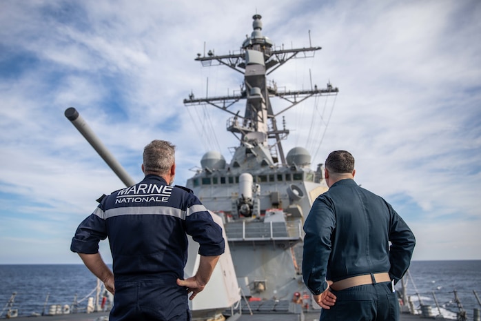 John Mastriani, right, commanding officer of the Arleigh Burke-class guided-missile destroyer USS Roosevelt (DDG 80), gives a tour of the forecastle to French Rear Adm. Christophe Cluzel, left, commander, French Carrier Strike Group (CSG), during his visit, Nov. 27, 2022. Roosevelt, currently attached to the Charles de Gaulle CSG, is on a scheduled deployment in the U.S. Naval Forces Europe area of operations, employed by U.S. Sixth Fleet to defend U.S., allied and partner interests.