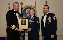 An Airman is presented with the John L. Levitow Award