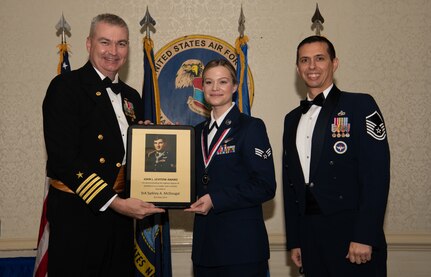 An Airman is presented with the John L. Levitow Award