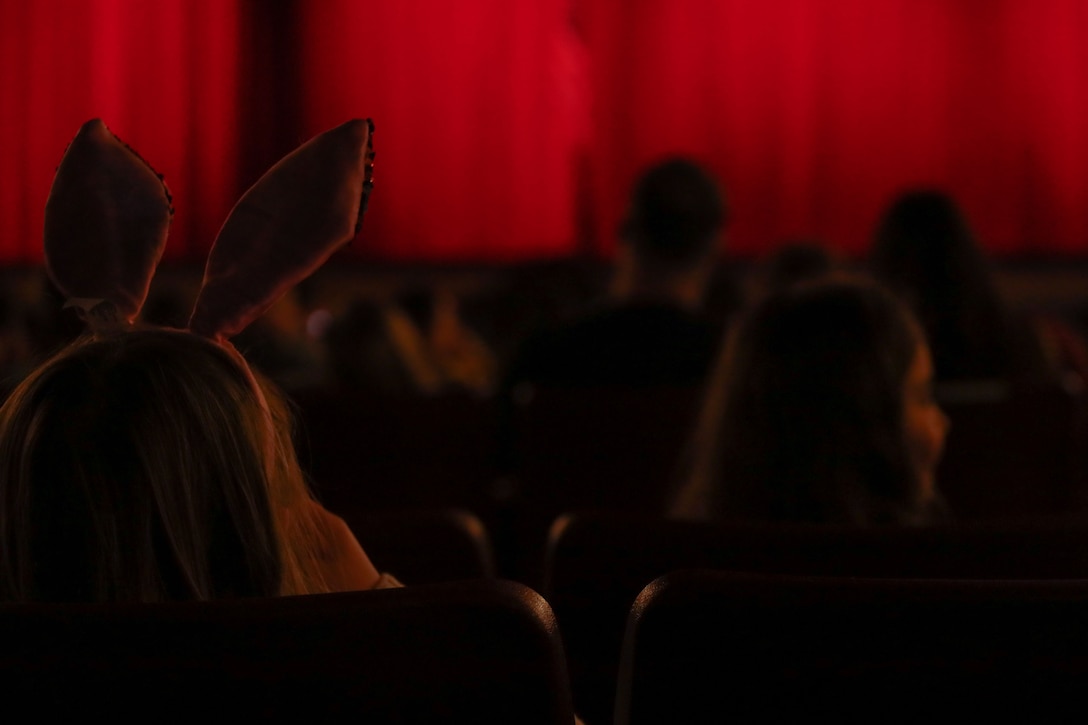 A child sits in the audience during the ballet performance of The Nutcracker by the Havelock Center of the Performing Arts at the Two Rivers Theater on Marine Corps Air Station Cherry Point, North Carolina, Dec. 18, 2022.