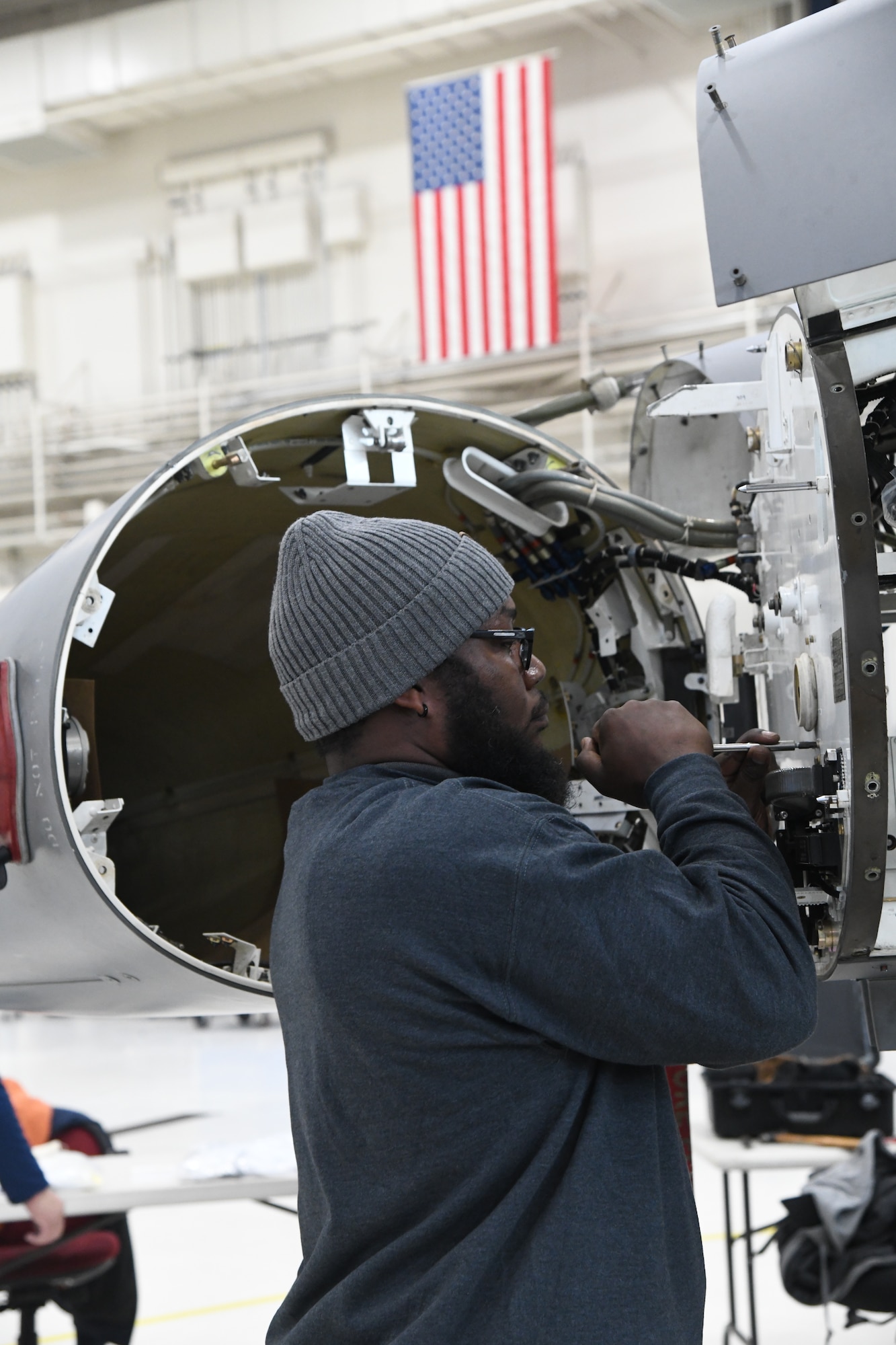 A contractor from Lockheed Martin installs the active electronic scanned array (AESA) radar on an F-16 Fighting Falcon assigned to the 148th Fighter Wing, Minnesota Air National Guard, on November 8, 2022 at the Duluth Air National Guard Base, Minnesota