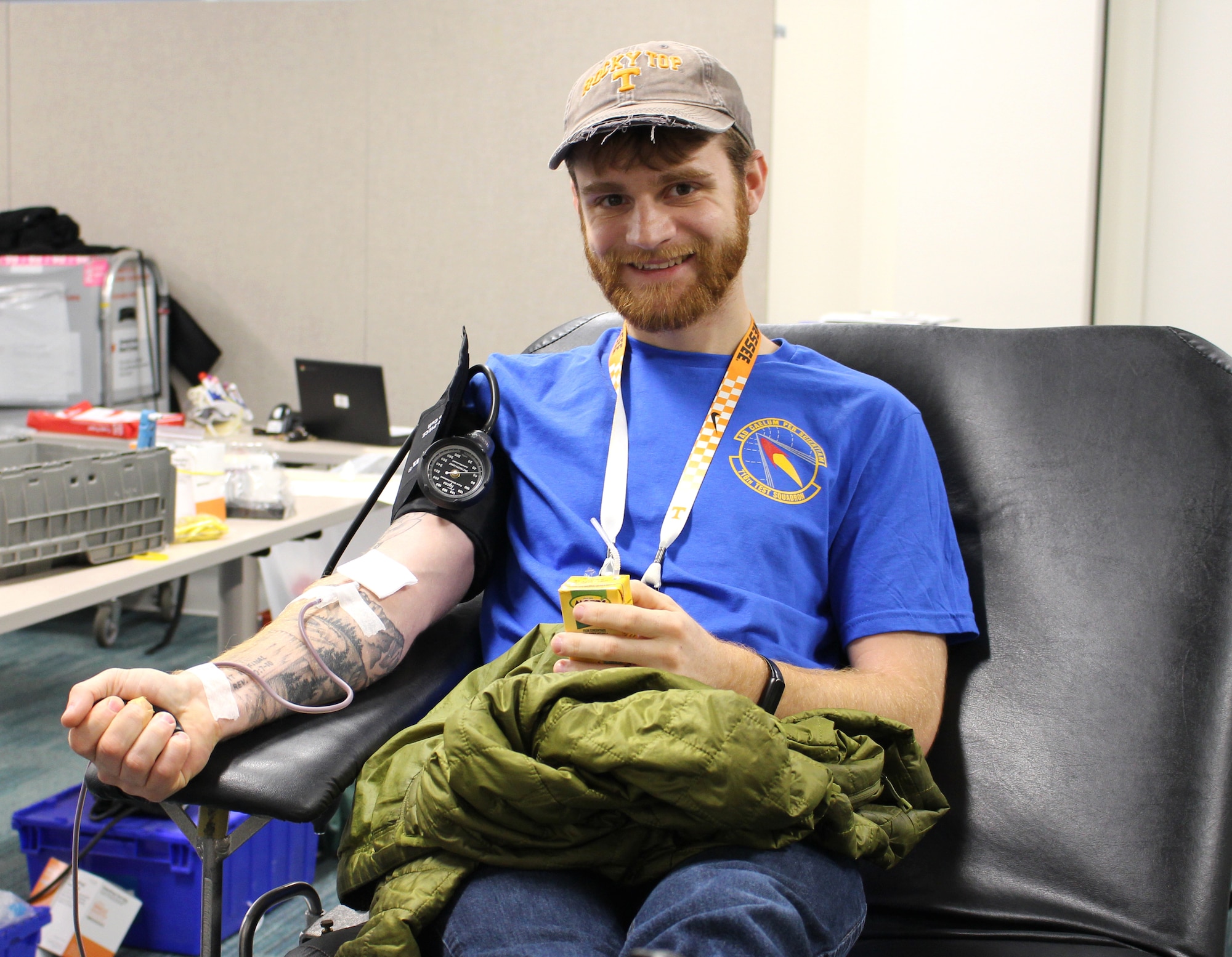 Daniel Epperson sits back in a chair while donating blood with the American Red Cross during a blood drive Dec. 8, 2022, at Arnold Air Force Base, Tennessee.