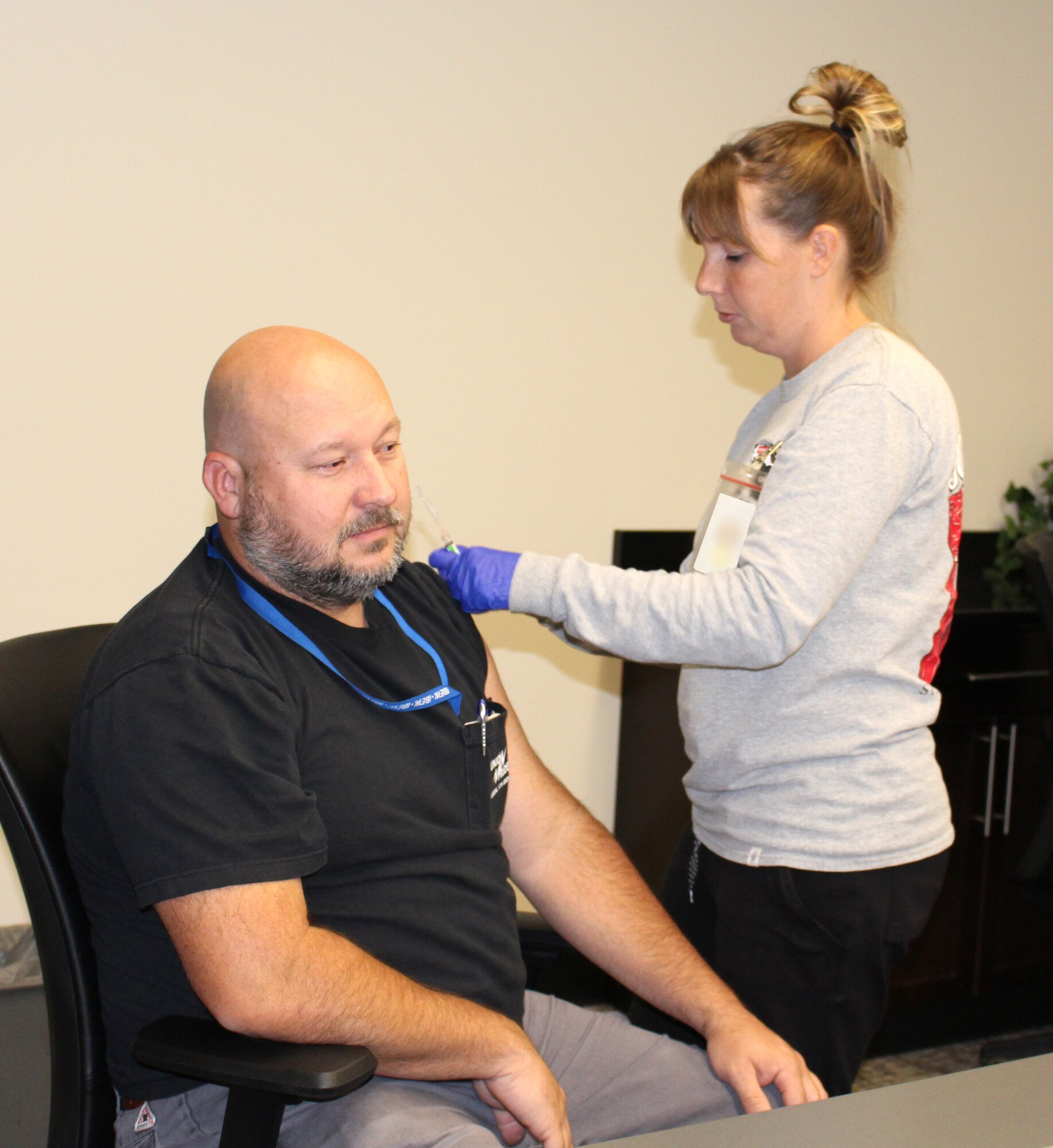 Teala Donaldson, with the Coffee County Health Department, administers a vaccination to Arnold Engineering Development Complex team member Michael Cleek.