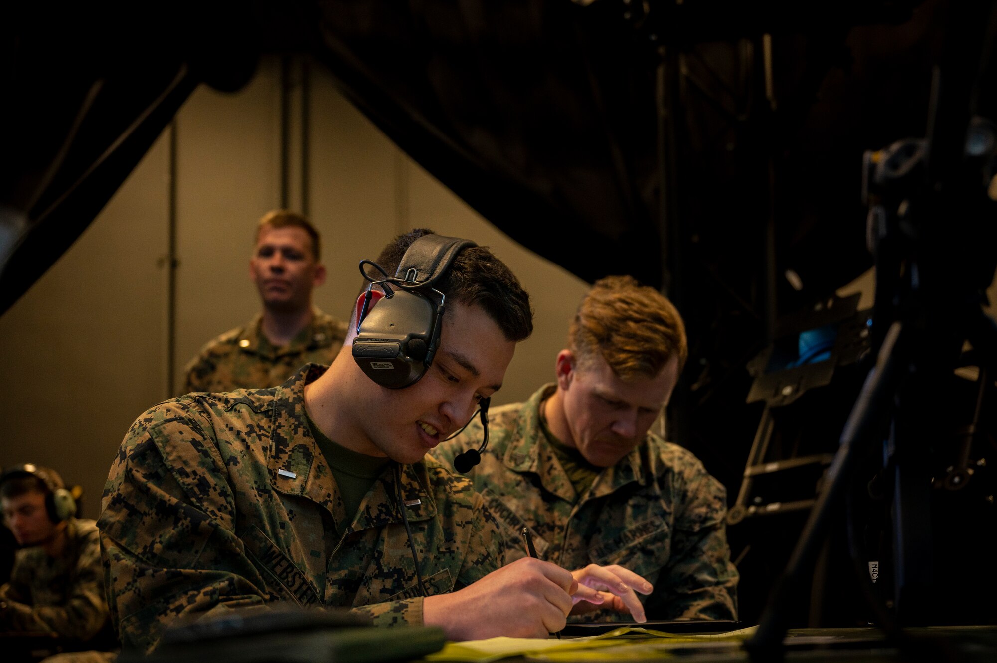 U.S. Marine 1st Lt. William Webster, air support control officer from Marine Air Support Squadron 2, Marine Corps Air Station Futenma, Japan, calls in close-air-support during a joint training at Osan Air Base, Republic of Korea, Dec. 15, 2022.