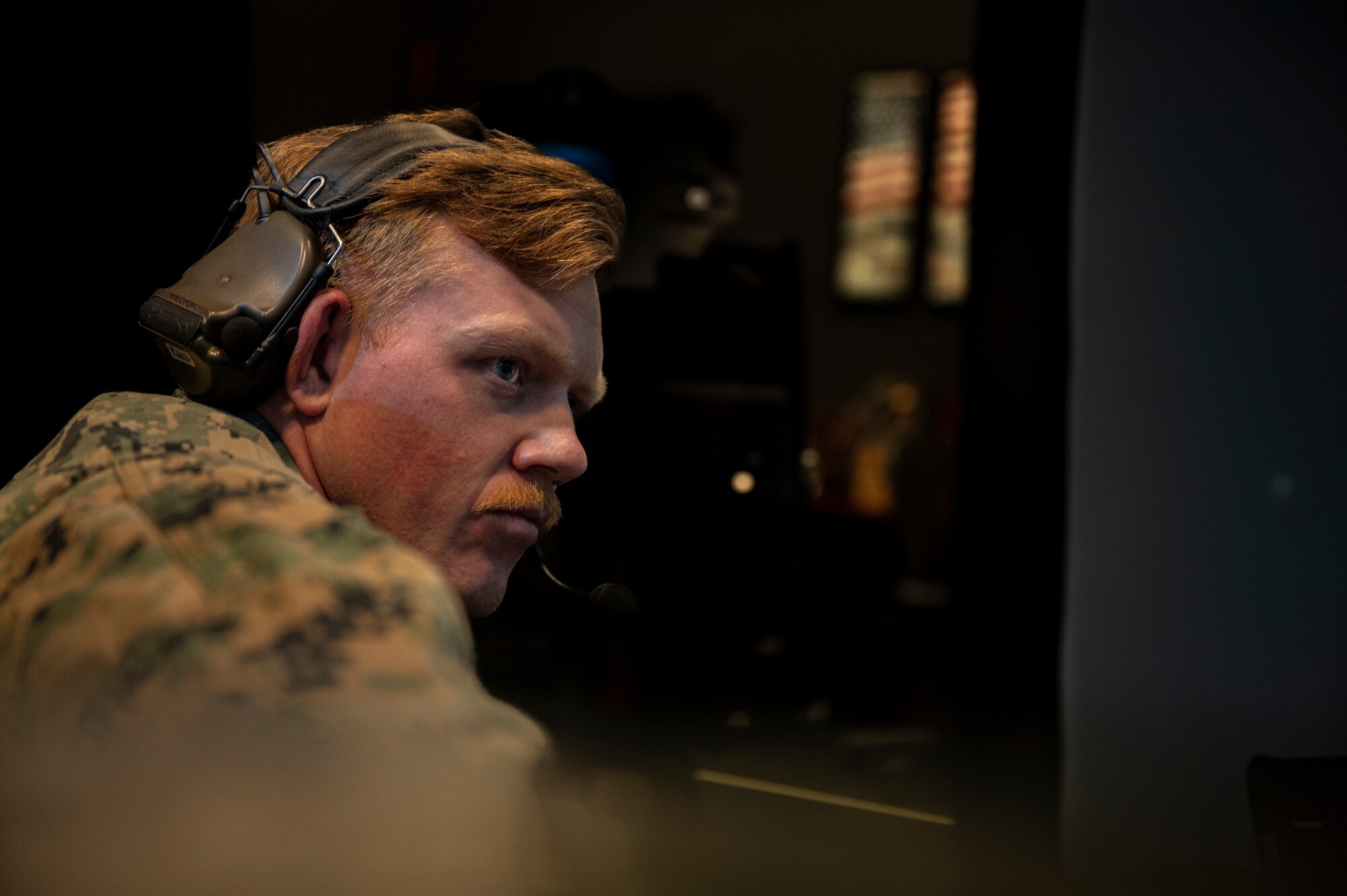 U.S. Marine Sgt. Ty Cochrane from Marine Air Support Squadron 2, Marine Corps Air Station Futenma, Japan, observes a simulated mission during a joint training at Osan Air Base, Republic of Korea, Dec. 15, 2022.