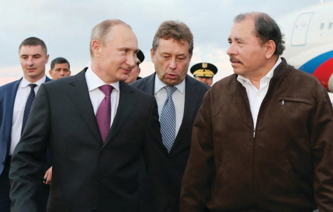 Russian President Vladimir Putin talks with Nicaraguan President Daniel Ortega