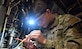 U.S. Army Pvt. Travis McCool, 128th Aviation Brigade, 210th Aviation Regiment, 1st Battalion, Advanced Individual Training student, inspects the tip of an electrical wire on a CH-47 Chinook helicopter simulator at Joint Base Langley-Eustis, Virginia, Dec. 15, 2022. Approximately 250 new Soldiers pass though the 128th Aviation Brigade’s aircraft electrician ‘15F’ military occupational specialty course each year. (U.S. Air Force photo by Abraham Essenmacher)