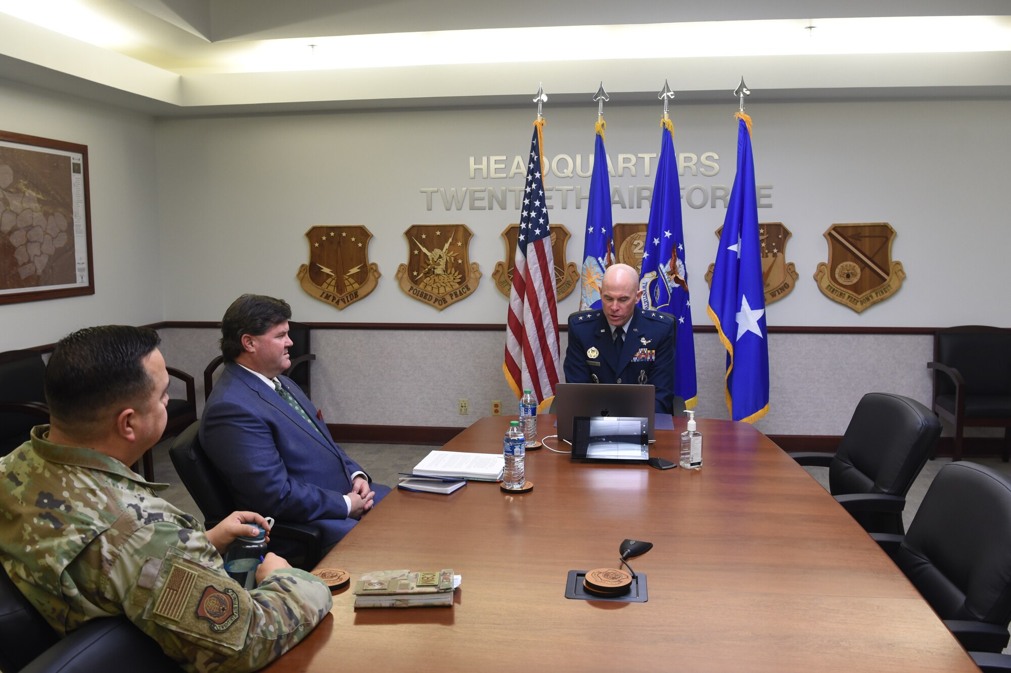 Maj. Gen. Michael Lutton, 20th Air Force commander, right, gives remarks