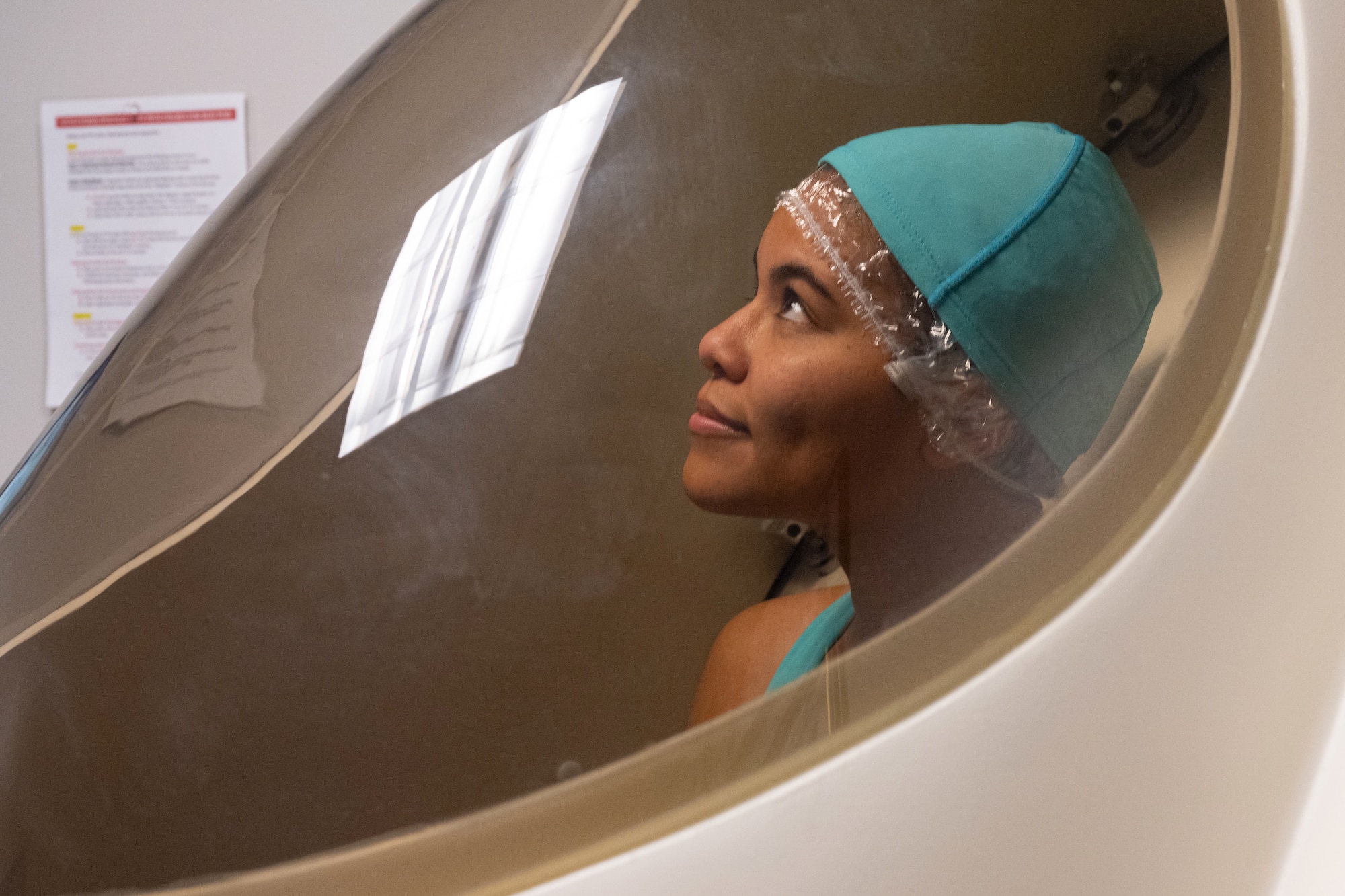 Service member sitting in the bod pod