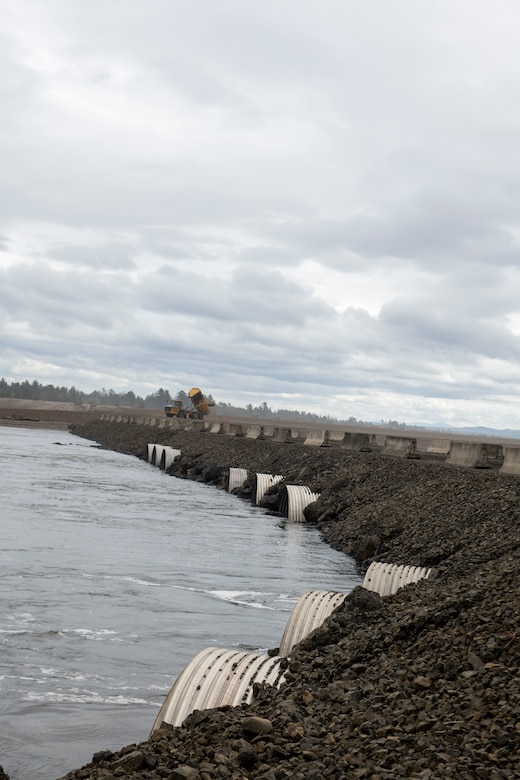 Photo of a row of corrugated steel pipes used to lay a culvert crossing along the Shoalwater Bay Dune on the Tokeland Peninsula, Washington.