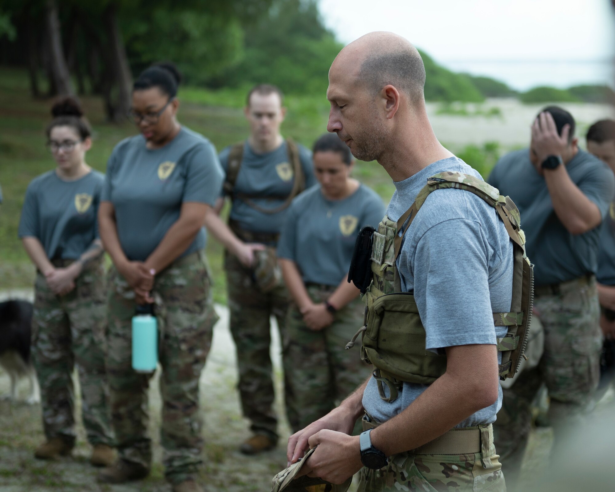 U.S. Air Force Maj. Aaron Throne, 36th Wing Chaplain Corps deputy wing chaplain, leads participants in prayer during the Office of Special Investigations’ Hustler-6 memorial on Andersen Air Force Base, Guam, Dec. 21, 2022. This annual event honors four OSI special agents and two Security Forces defenders that lost their lives during a mission near Bagram, Afghanistan on Dec. 21, 2015. (U.S. Air Force photo by Airman Spencer Perkins)