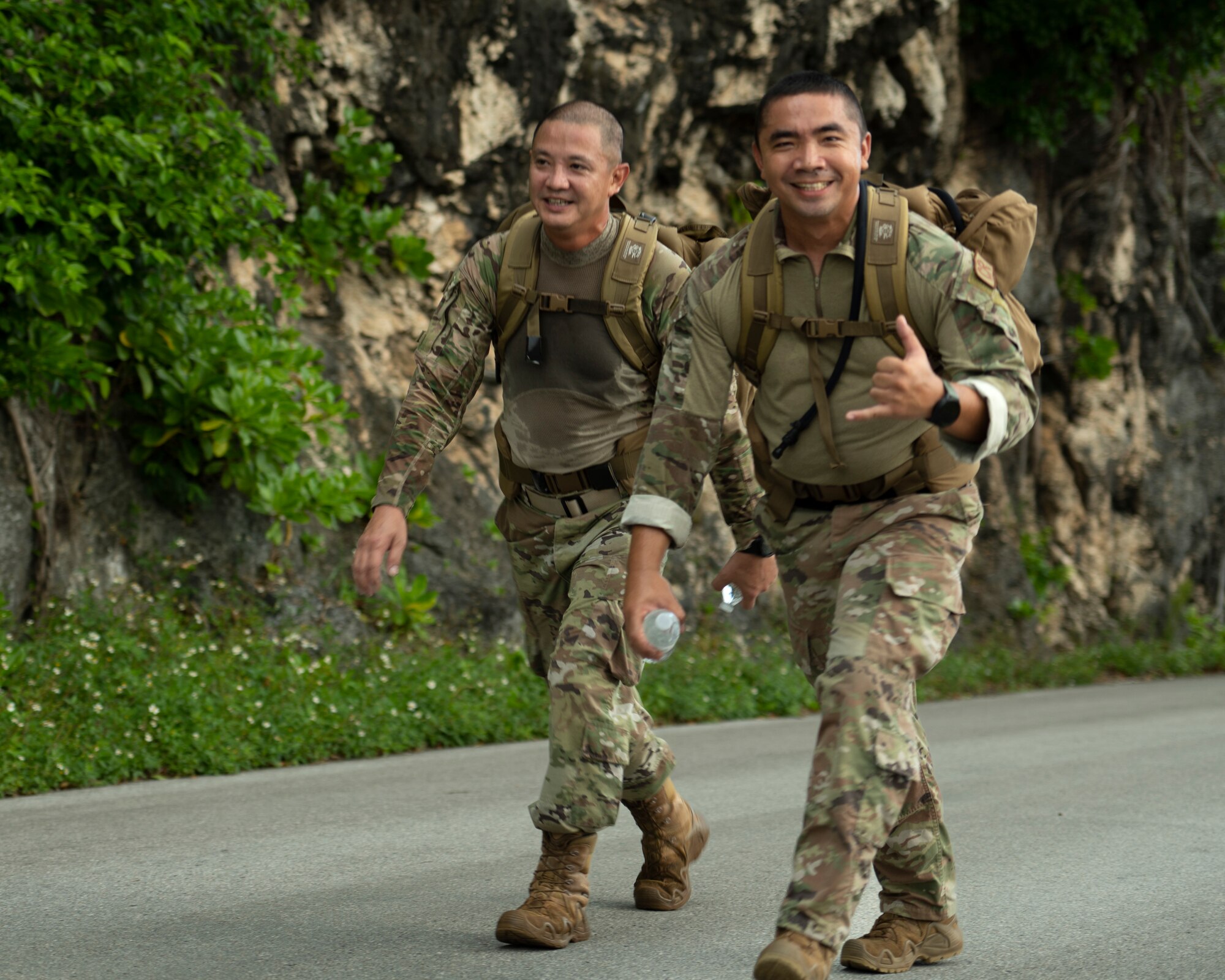 U.S. Air Force service members walk up Sanders Slope during the Office of Special Investigations’ Hustler-6 memorial event on Andersen Air Force Base, Guam, Dec. 21, 2022. Since 2016, OSI agents assigned to Andersen AFB have annually honored the Hustler-6, who lost their lives during a mission near Bagram, Afghanistan on Dec. 21, 2015, by rucking up and down Sanders Slope. (U.S. Air Force photo by Airman Spencer Perkins)