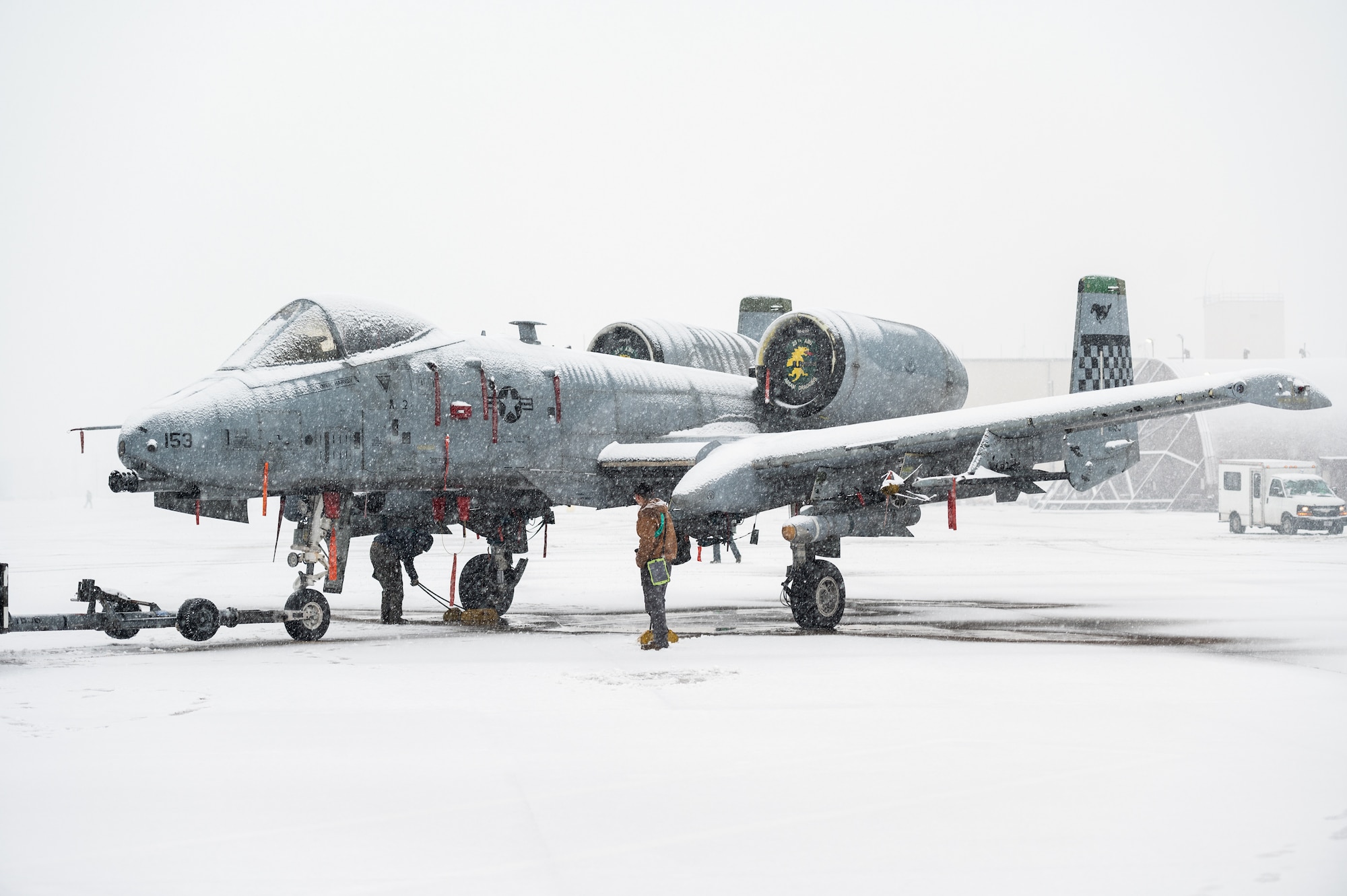 U.S. Air Force Staff Sgts. Ashlyn Brock and John-Michael Salenga, 25th Fighter Generation Squadron crew chiefs, remove chocks from an A-10C Thunderbolt II during an FGS training event
