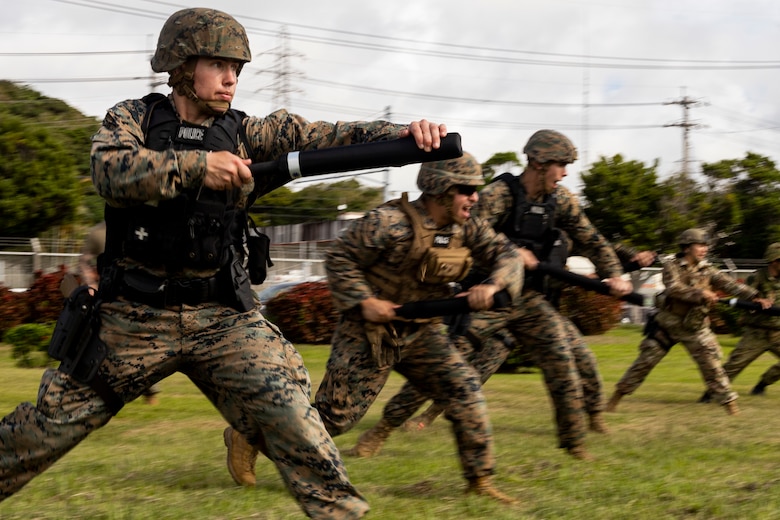 U.S. Marines with Provost Marshal’s Office, Marine Corps Installations Pacific, practice baton techniques during Exercise Keen Sword 2023 on Camp Foster, Okinawa, Japan, Nov. 13, 2022. Keen Sword exercises the combined command and control capabilities and lethality developed between MCIPAC, III Marine Expeditionary Force, and the Japan Self-Defense Force. This bilateral field-training demonstrates the U.S. military and JSDF interoperability and combat readiness of the U.S.-Japan Alliance. (U.S. Marine Corps photo by Lance Cpl. Thomas Sheng)