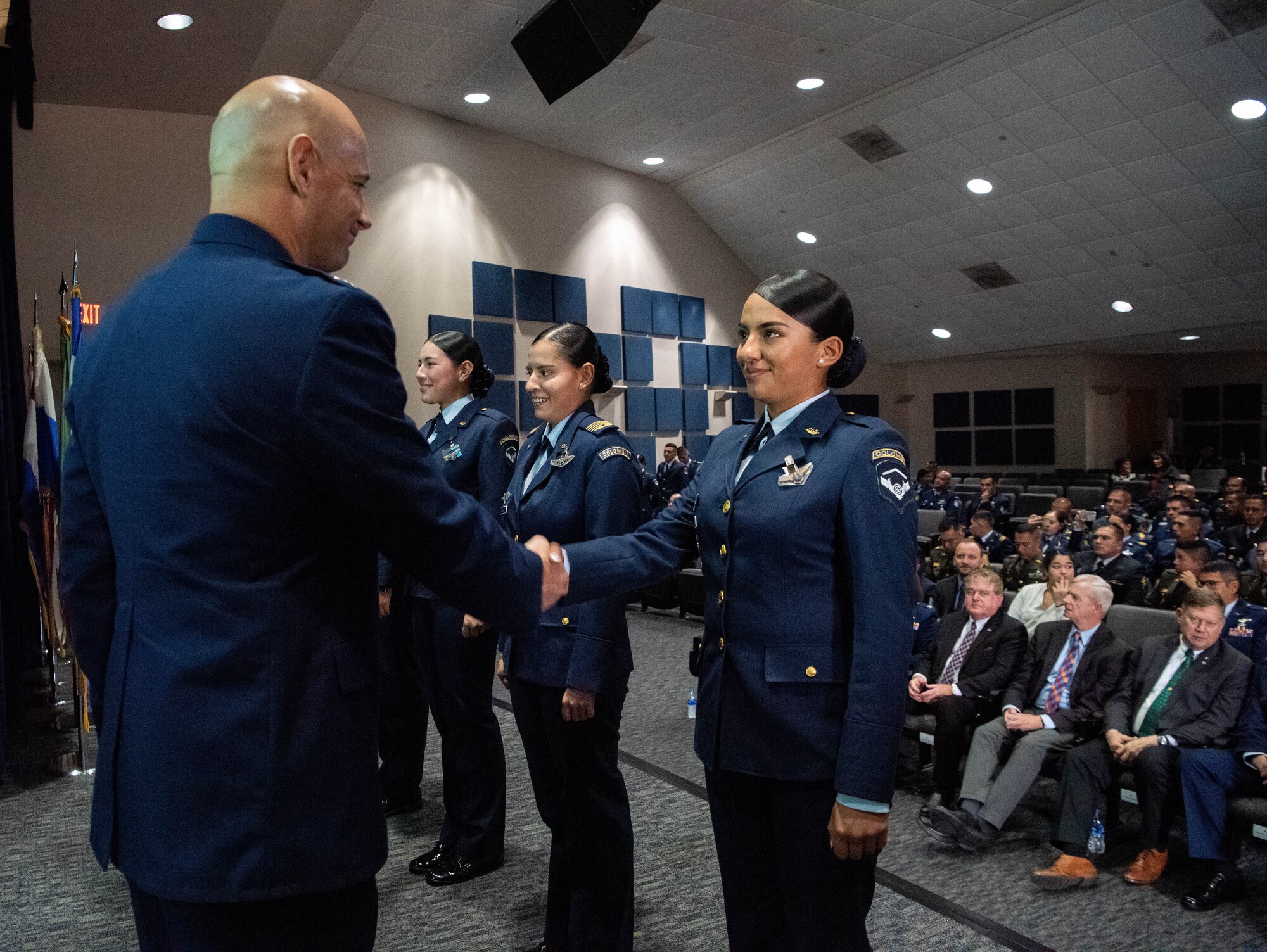 Col. José Jiménez, Jr., commandant of the Inter-American Air Forces Academy, shakes hands with an international military during the Academy’s graduation ceremony at Joint Base San Antonio-Lackland, Texas, Dec. 7, 2022. More than 150 international military students from 12 partner nations across Latin America and the USAF graduated during the last training cycle of 2022. (U.S. Air Force photo by Vanessa R. Adame)