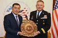 Army Maj. Gen. Janson D. Boyles, the adjutant general of the Mississippi National Guard, showcases a traditional wood plate presented from Uzbekistan Foreign Minister Vladimir Norov during a reception at the Embassy of the Republic of Uzbekistan in Washington Dec. 12, 2022. The Guard and Uzbekistan celebrated the 10-year anniversary of their partnership under the Defense Department National Guard Bureau State Partnership Program.