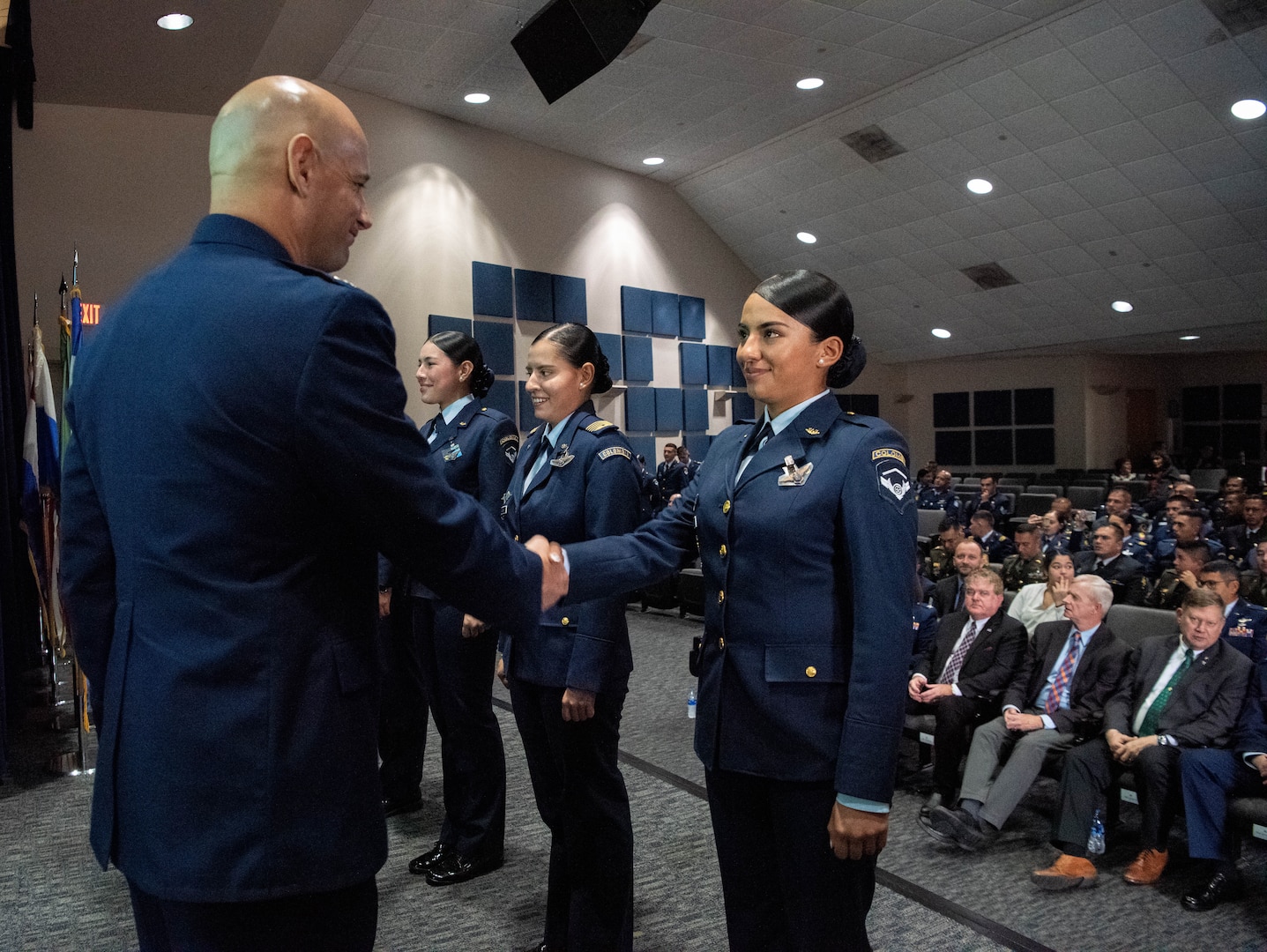 Col. José Jiménez, Jr., commandant of the Inter-American Air Forces Academy, shakes hands with an international military during the Academy’s graduation ceremony at Joint Base San Antonio-Lackland, Texas, Dec. 7, 2022. More than 150 international military students from 12 partner nations across Latin America and the USAF graduated during the last training cycle of 2022. (U.S. Air Force photo by Vanessa R. Adame)