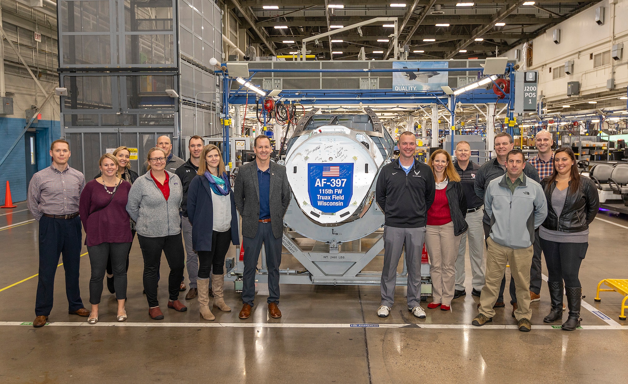 Members pose for a photo at Lockheed Martin Aeronautics